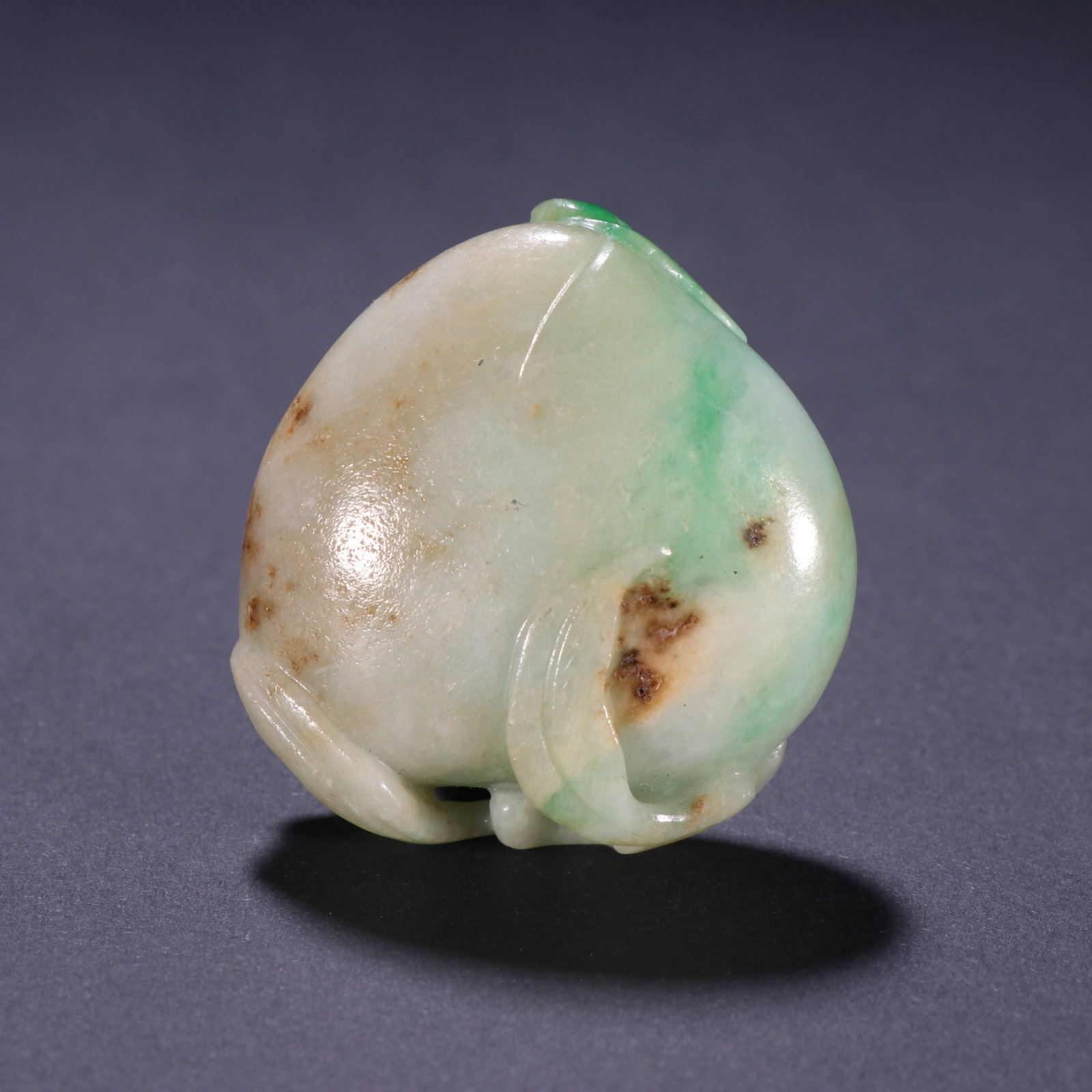 An Exquisite Jadeite Longevity Peach Hand Piece