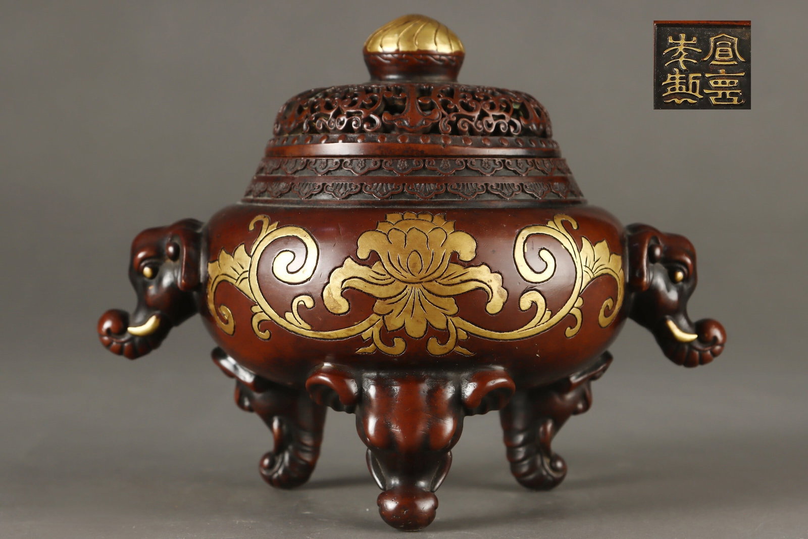 An Exquisite Gilt Bronze Elephant Head Handled Incense Burner with Interlocking Floral Scrolls (1 of 9)