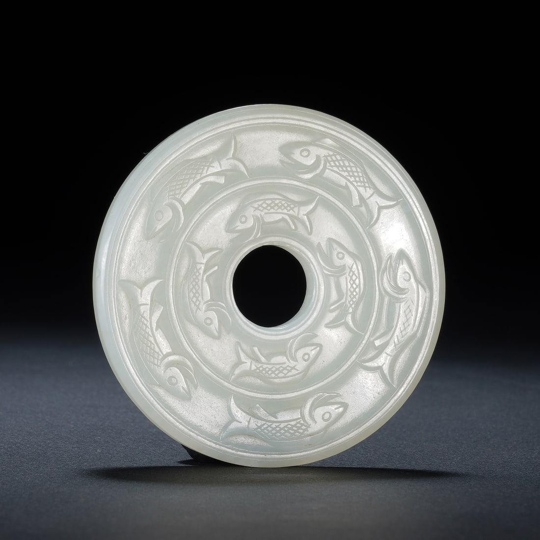 An Exquisite White Jade Bi Disc With Nine Fish Patterns (1 of 7)