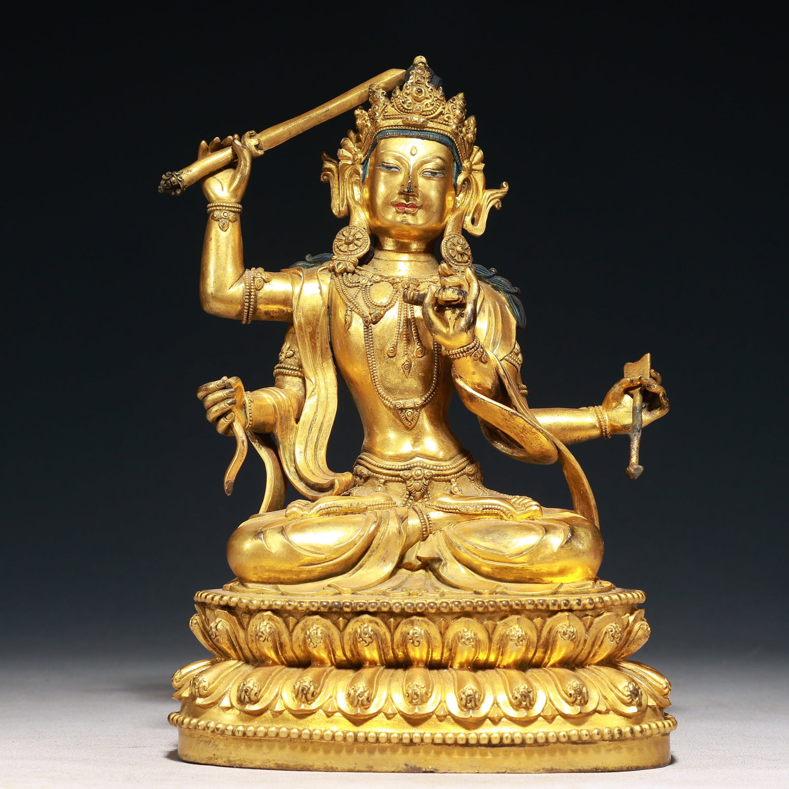 A Solemn Gilt Bronze Statue of Manjusri: A Solemn Gilt Bronze Statue of Manjusri,Qing Dynasty,China,Size:6.7inx3.9inx9.8in,Weight:3050g 铜鎏金文殊菩萨像,中国清代