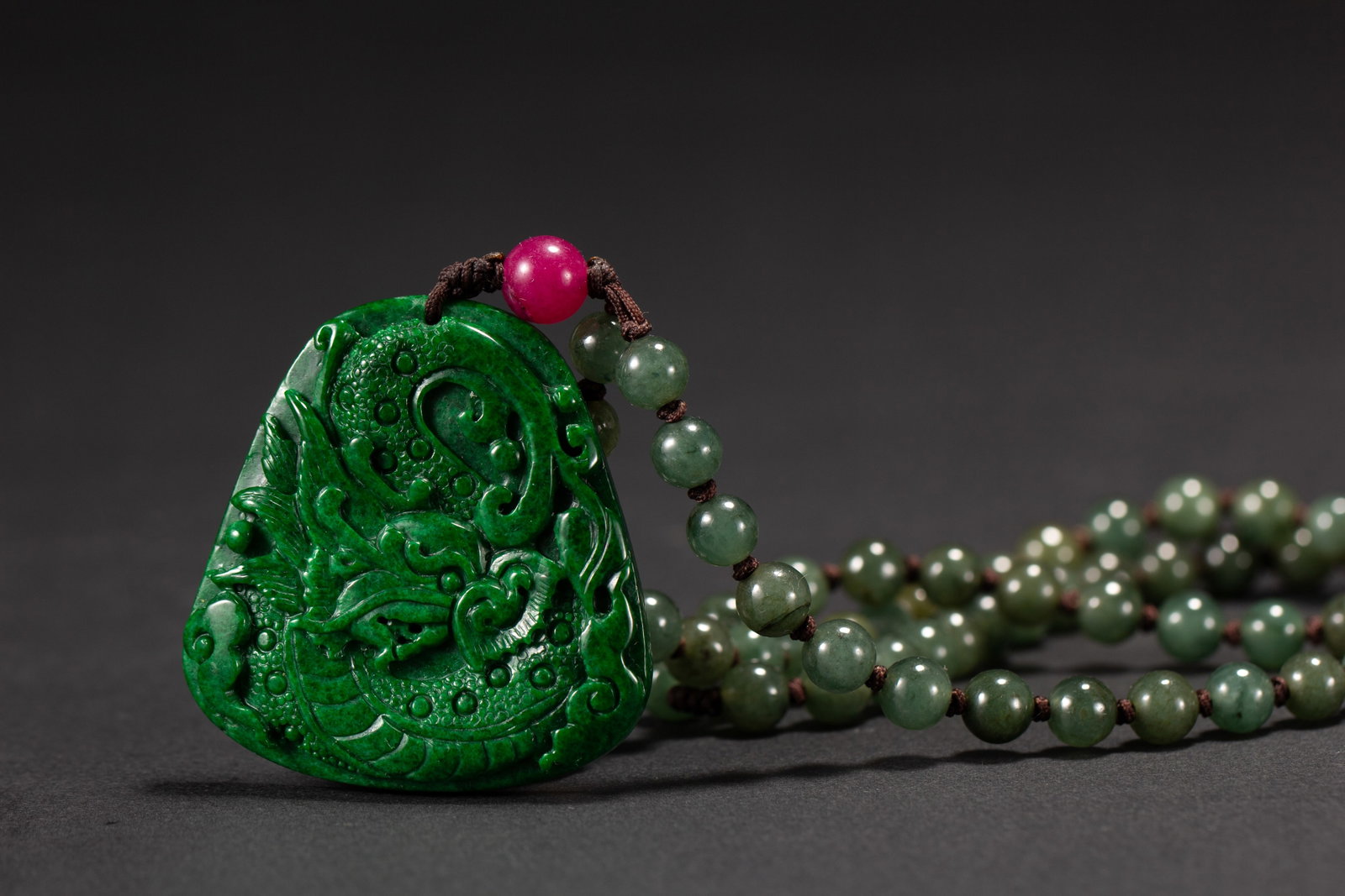 An Exquisite Jadeite Pendant Carved With Dragon Pattern (1 of 8)