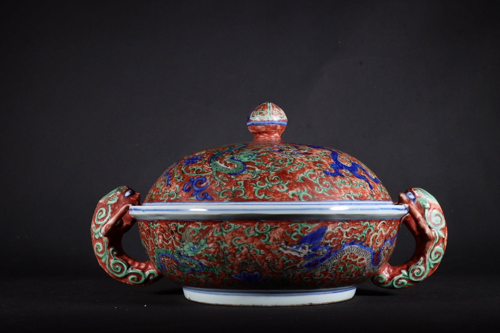 A Fine Double-eared Covered Box,Underglaze Blue Dragon On Red Ground: A Fine Double-eared Covered Box,Underglaze Blue Dragon On Red Ground,Ming Dynasty,China,Jiajing Six-character Mark,Size:5.1inx7.9in,红地青花龙纹双耳