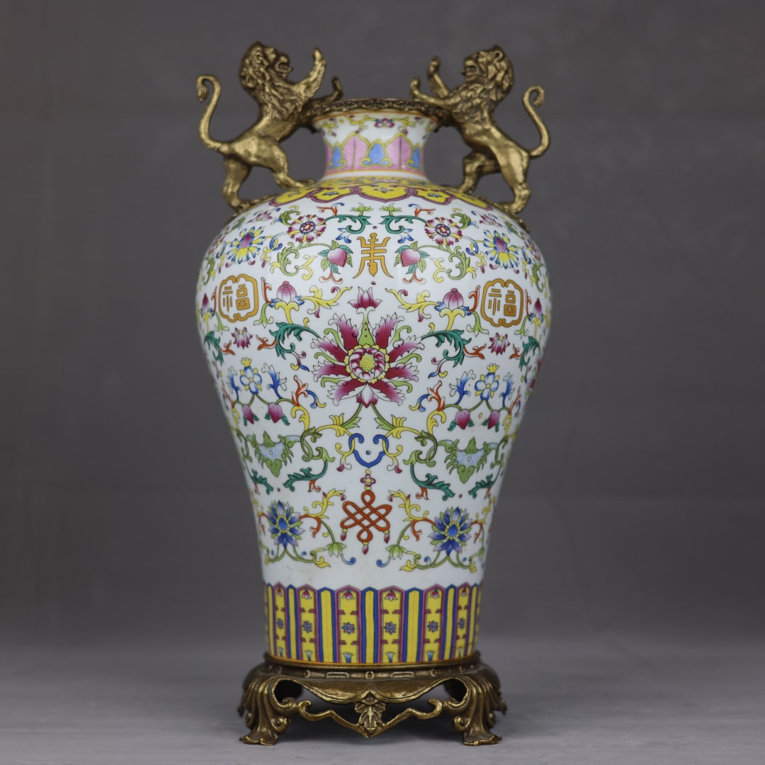 An Exquisite Famille Rose Plum Vase With Copper Lion Ears,Interlocking Blessing Longevity Pattern: An Exquisite Famille Rose Plum Vase With Copper Lion Ears,Interlocking Blessing Longevity Pattern,China Qing Dynasty,Six-Character Kangxi Mark,Dimensions:17.3inx8.7in,粉彩福寿&