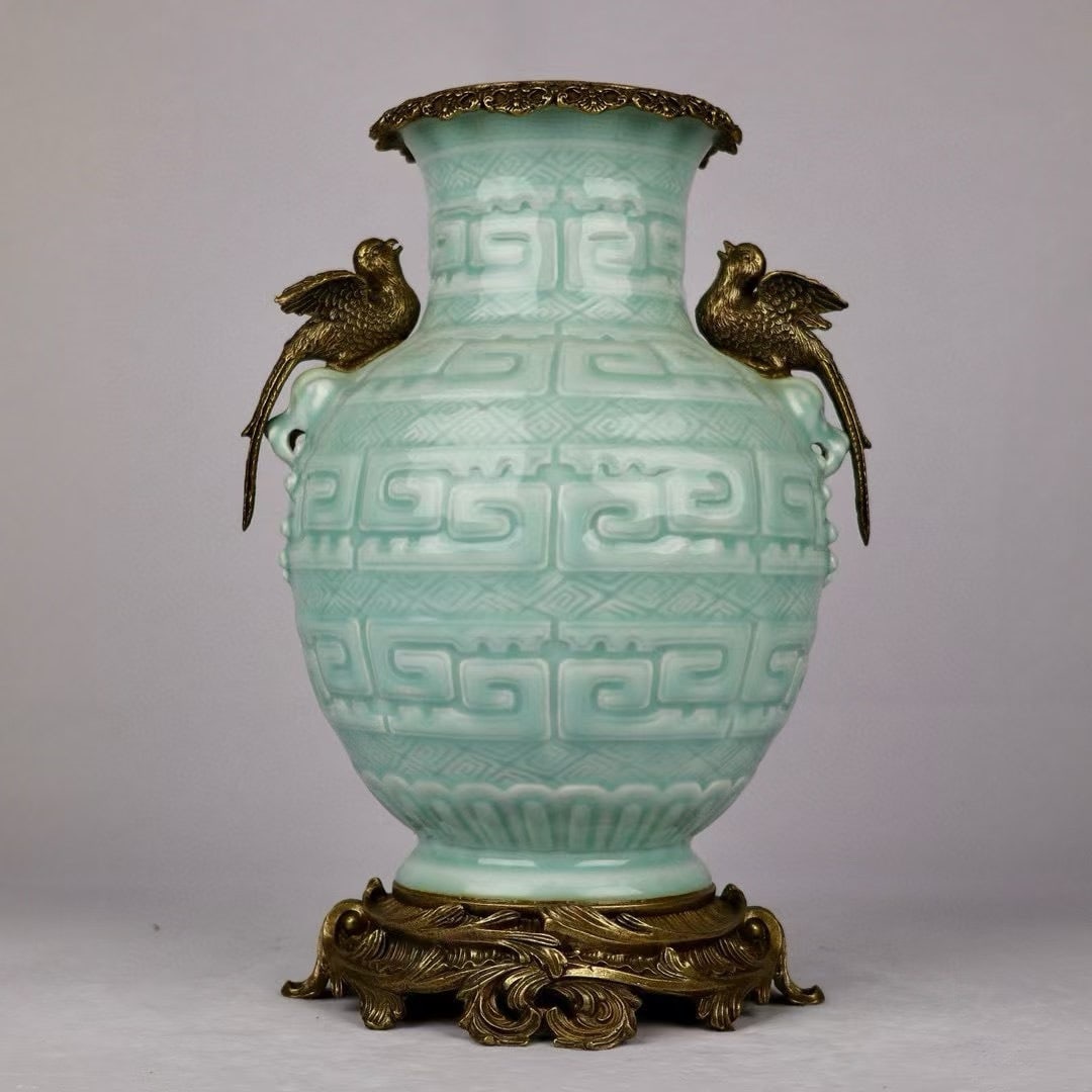 An Exquisite Light Celadon Glaze Zun With Double Copper Bird Ears: An Exquisite Light Celadon Glaze Zun With Double Copper Bird Ears,China Qing Dynasty,Six-Character Qianlong Mark,Dimensions:13.4inx9.4in,粉青釉镶铜鸟双耳