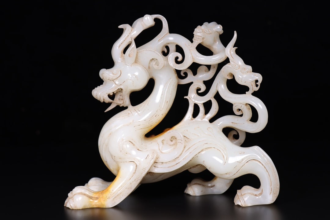 A Fine White Jade Auspicious Beast Ornament (1 of 9)