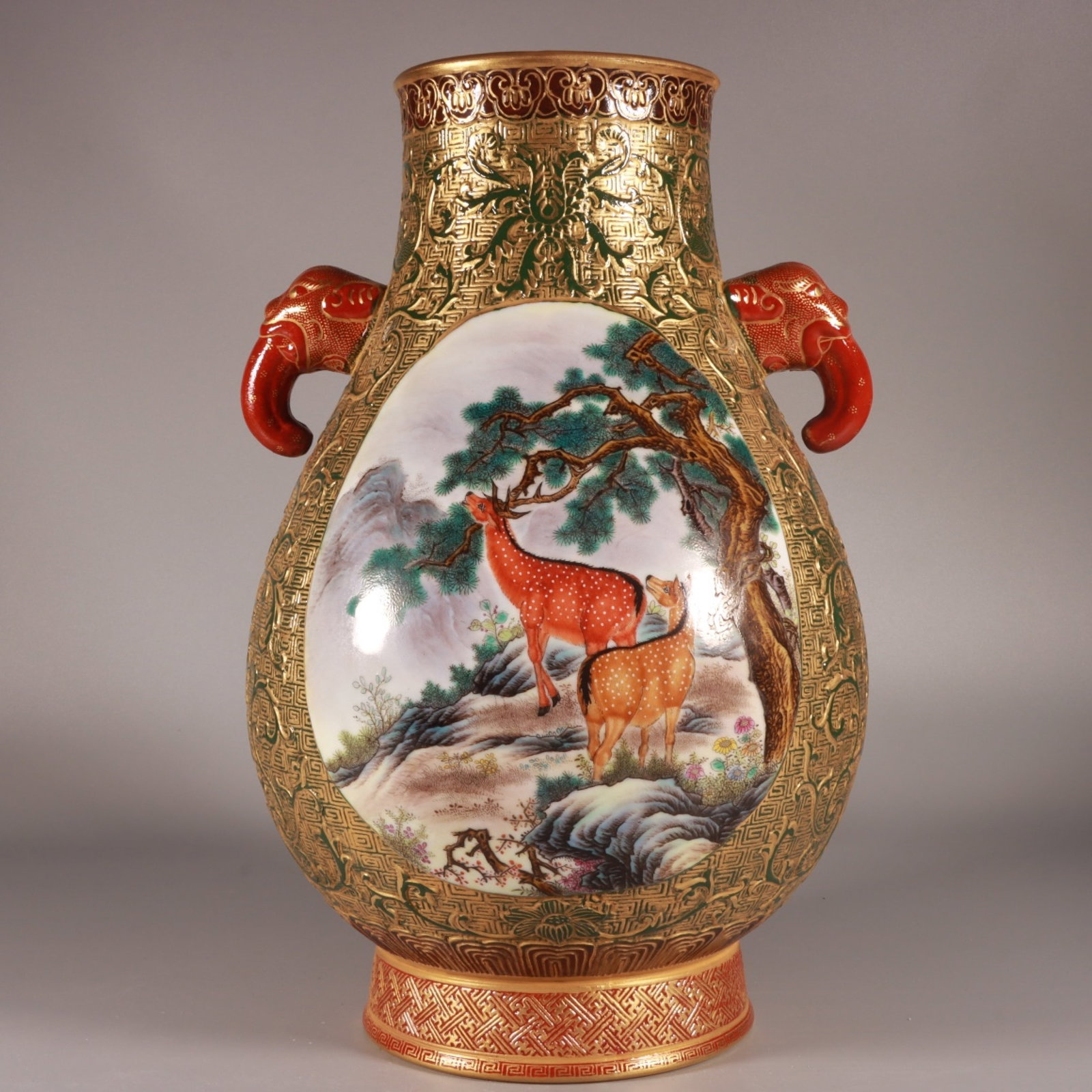 A Fine Enamel Color Green Ground Carved Gilt Elephant-Eared Zun with Beast Panels: A Fine Enamel Color Green Ground Carved Gilt Elephant-Eared Zun with Beast Panels,Qing Dynasty,China,Qianlong Four-character Mark,Size:12.2inx7.9in,珐琅彩绿地雕
