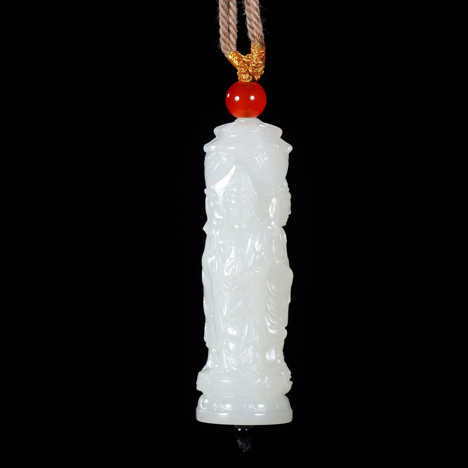 An Exquisite Cylindrical White Jade Pendant Carved With Three-Faced Buddha (1 of 7)