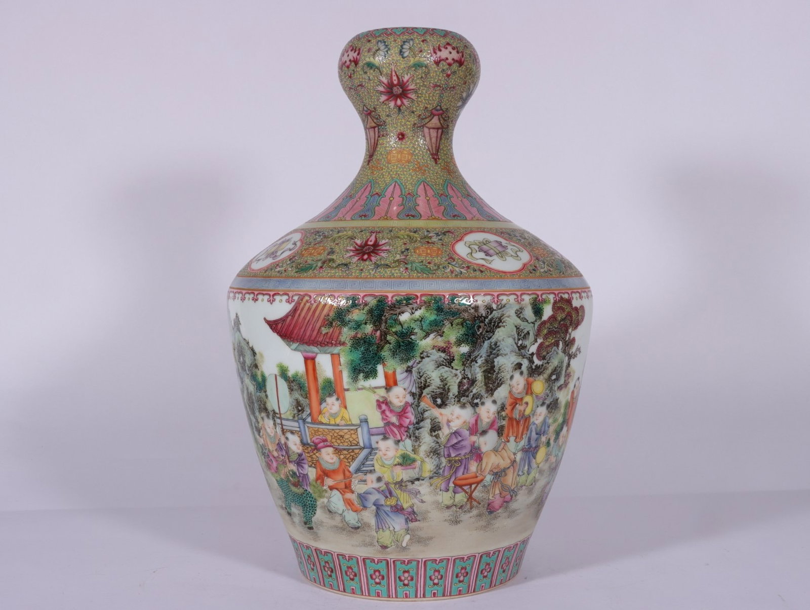 A Fine Famille Rose Guyuexuan Garlic-Mouth Vase with Continuous Hundred Boys Pattern: A Fine Famille Rose Guyuexuan Garlic-Mouth Vase with Continuous Hundred Boys Pattern,Qing Dynasty,China,Qianlong Four-character Mark,Size:14.6inx10.2in,粉彩古月轩通