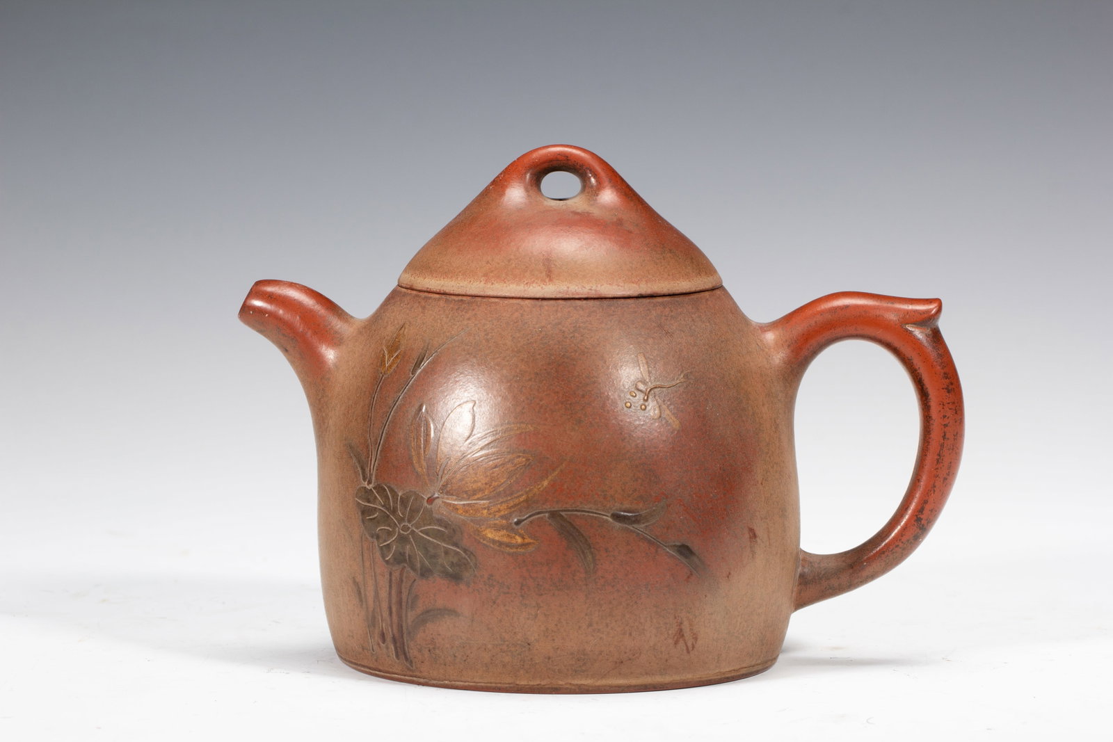 An Exquisite Yixing Clay Teapot With Lotus Pond And Dragonfly Pattern (1 of 11)