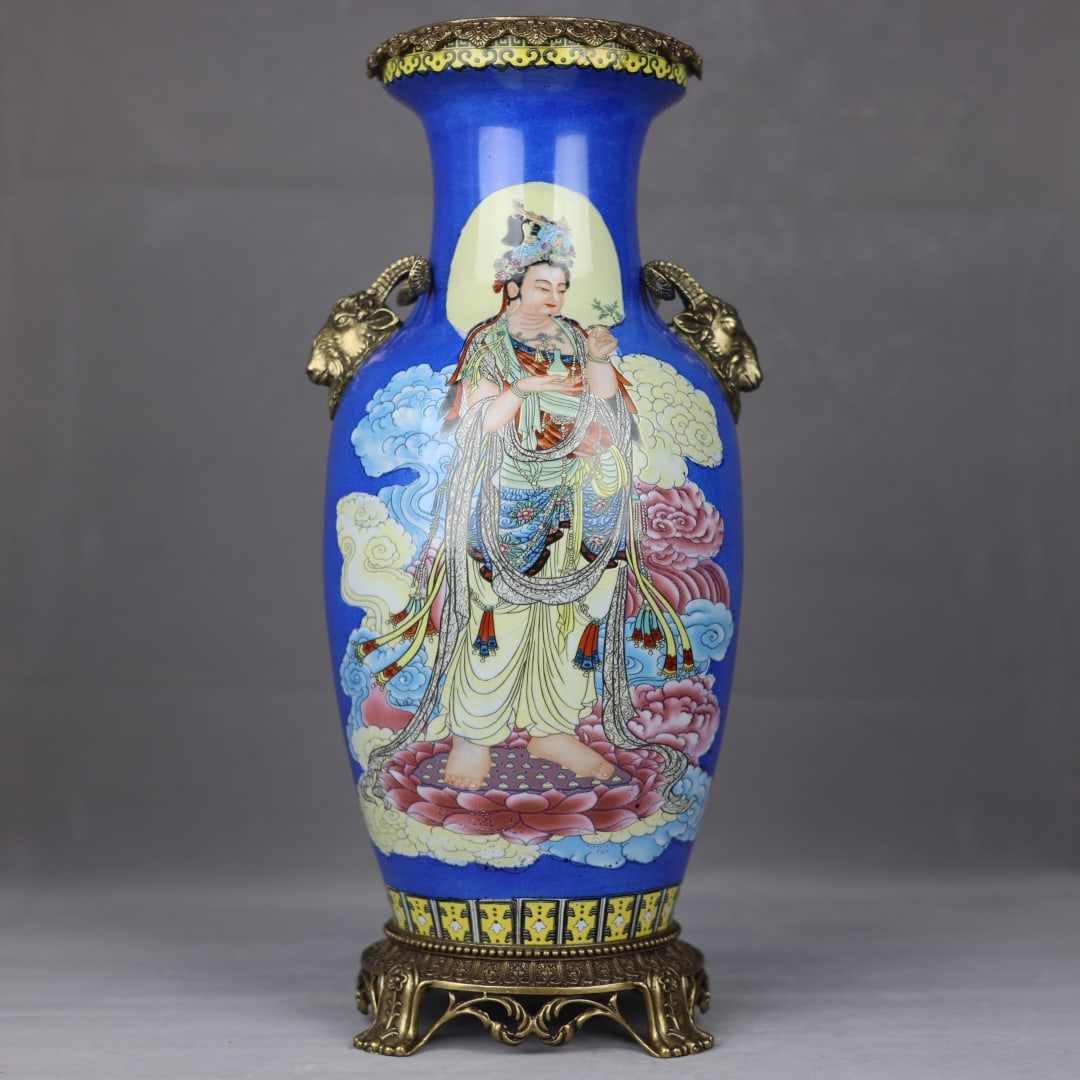 An Exquisite Blue Ground Famille Rose Vase With Copper Sheep Ears,Guanyin Pattern: An Exquisite Blue Ground Famille Rose Vase With Copper Sheep Ears,Guanyin Pattern,China Qing Dynasty,Six-Character Kangxi Mark,Dimensions:19.5inx9.3in,蓝地粉彩观音&