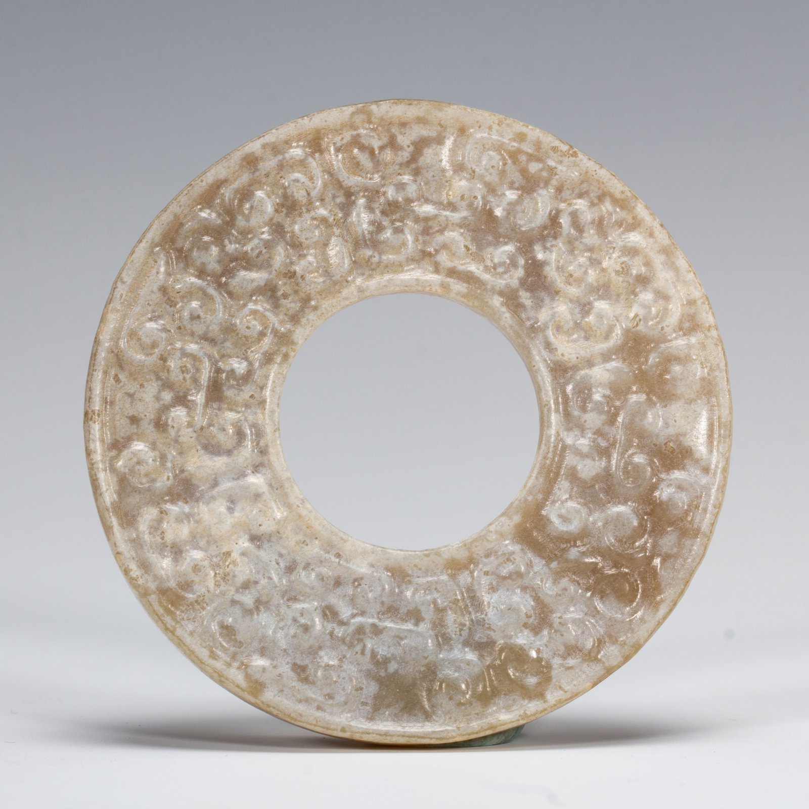 An Exquisite White Jade Bi Disc With Coiled Serpent Patterns (1 of 6)
