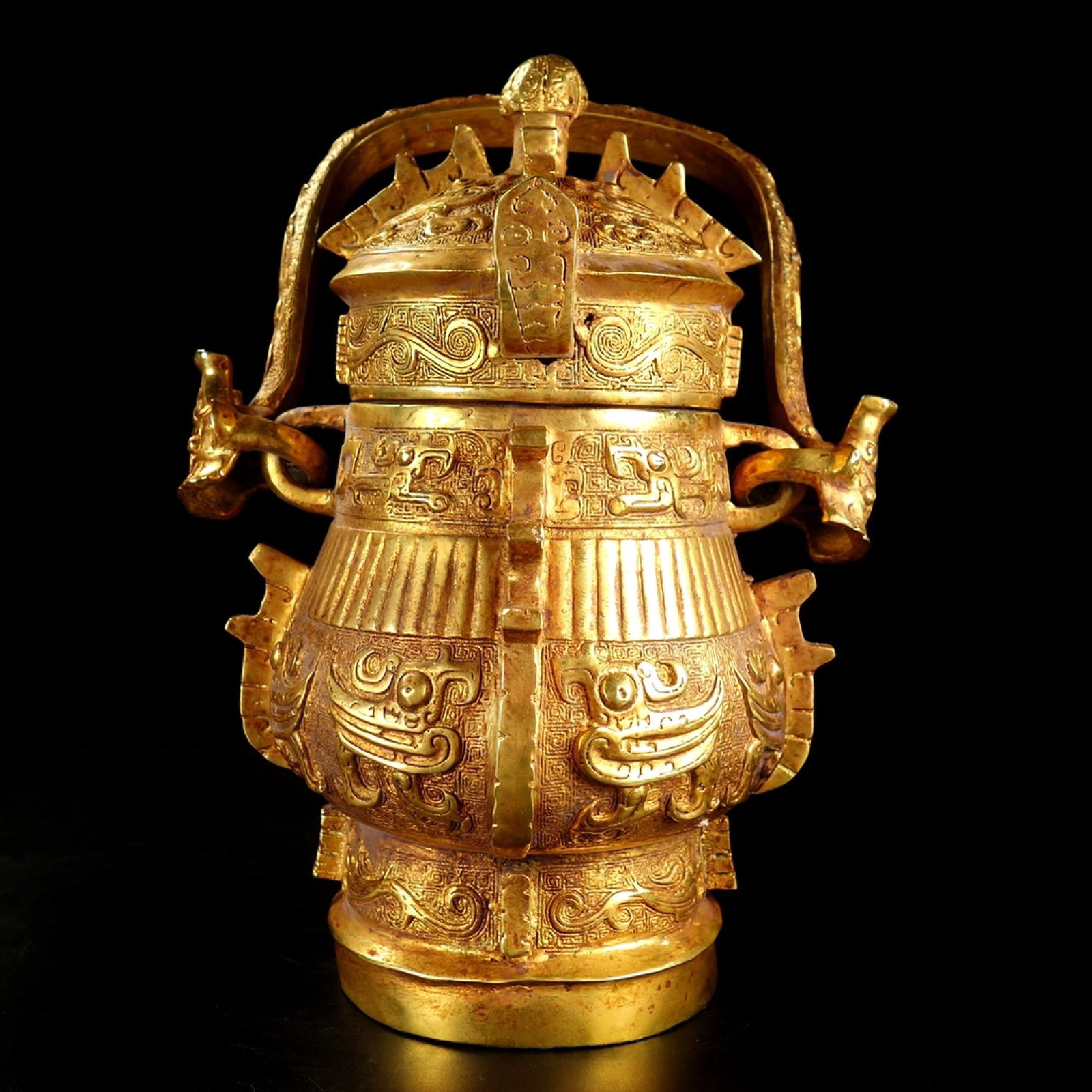 An Exquisite Gilt Bronze Loop Handle Pot With Taotie Patterns (1 of 9)