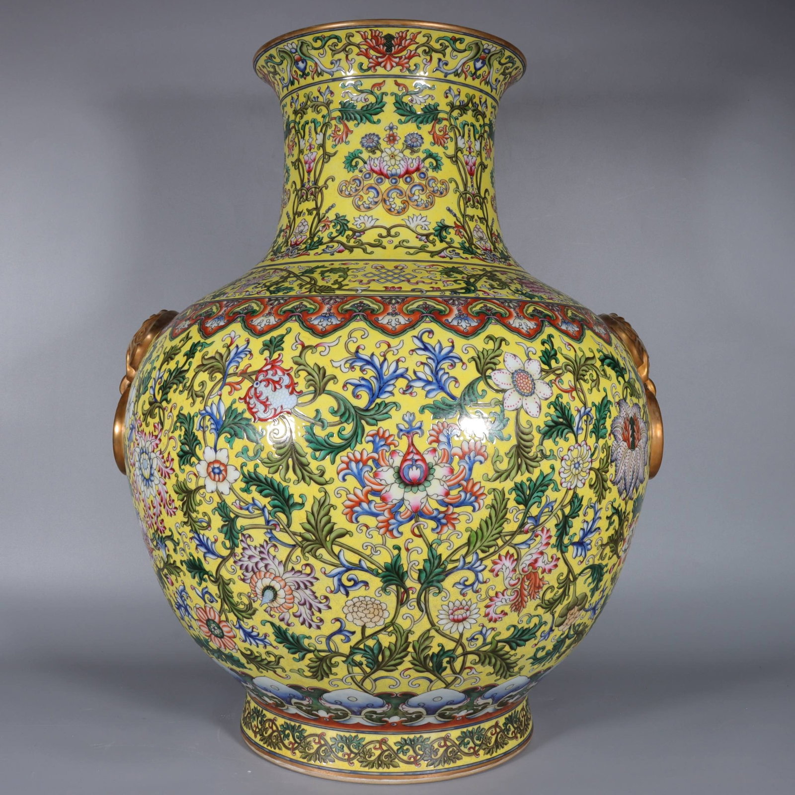 A Fine Yellow Ground Gilt Famille Rose Lion-Eared Vase,Interlocking Lotus and Scroll Grass Patterns: A Fine Yellow Ground Gilt Famille Rose Lion-Eared Vase,Interlocking Lotus and Scroll Grass Patterns,Qing Dynasty,China,Qianlong Six-character
