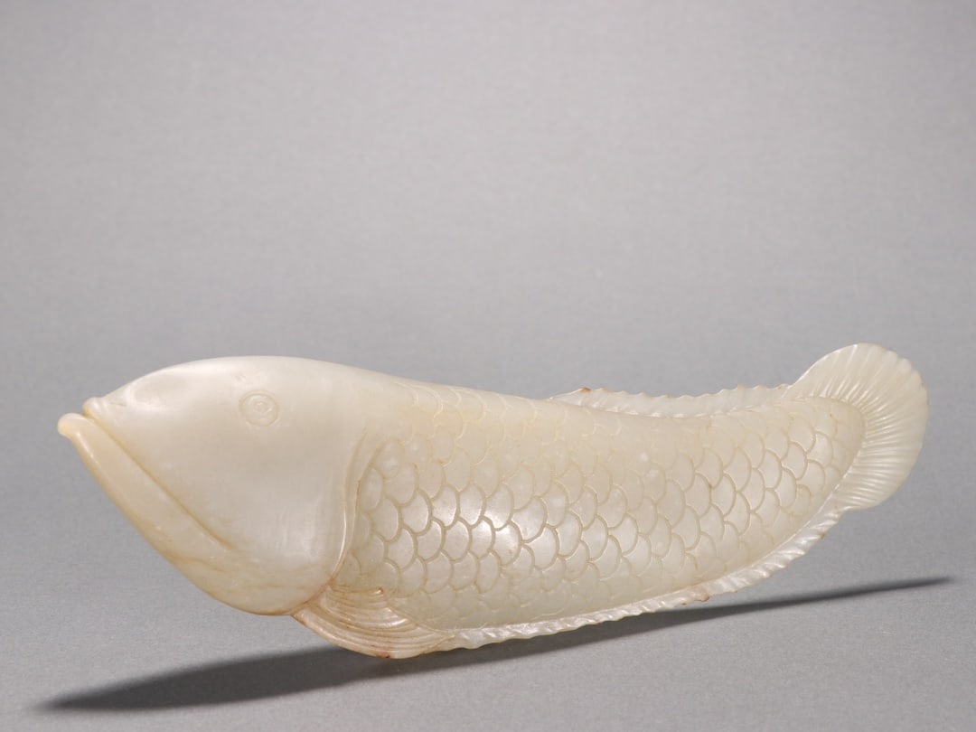 A Fine White Jade Fish?Shaped Ornament: A Fine White Jade Fish‑Shaped Ornament,China,Qing Dynasty,Dimensions:9.1inx2.8in,白玉鱼形摆件,中国清代
