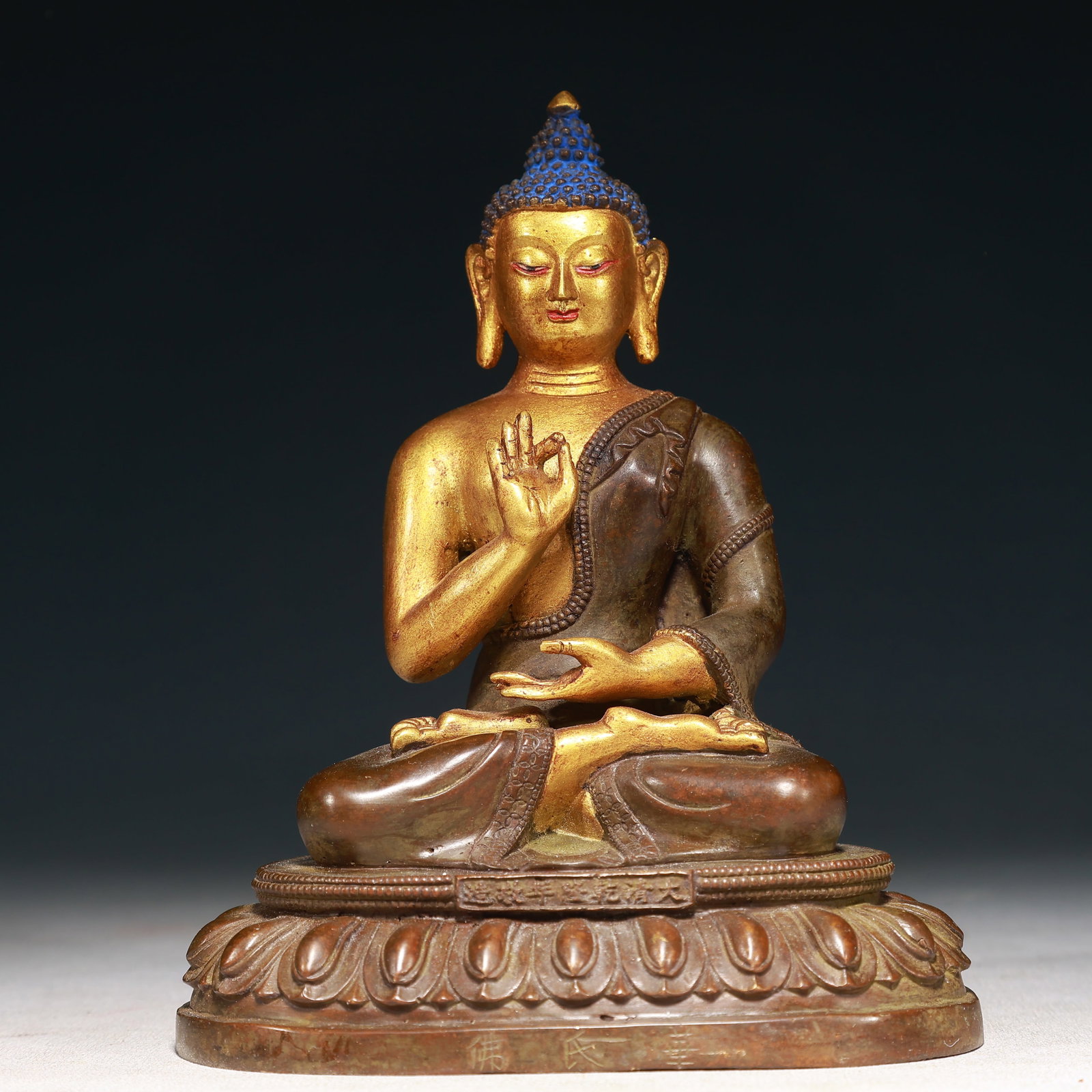 A Solemn Gilt Bronze Statue of Sakyamuni: A Solemn Gilt Bronze Statue of Sakyamuni,Qing Dynasty,China,Qianlong Mark,Size:5.5inx3.3inx6.7in,Weight:1300g 铜鎏金释迦摩尼像,中国清&