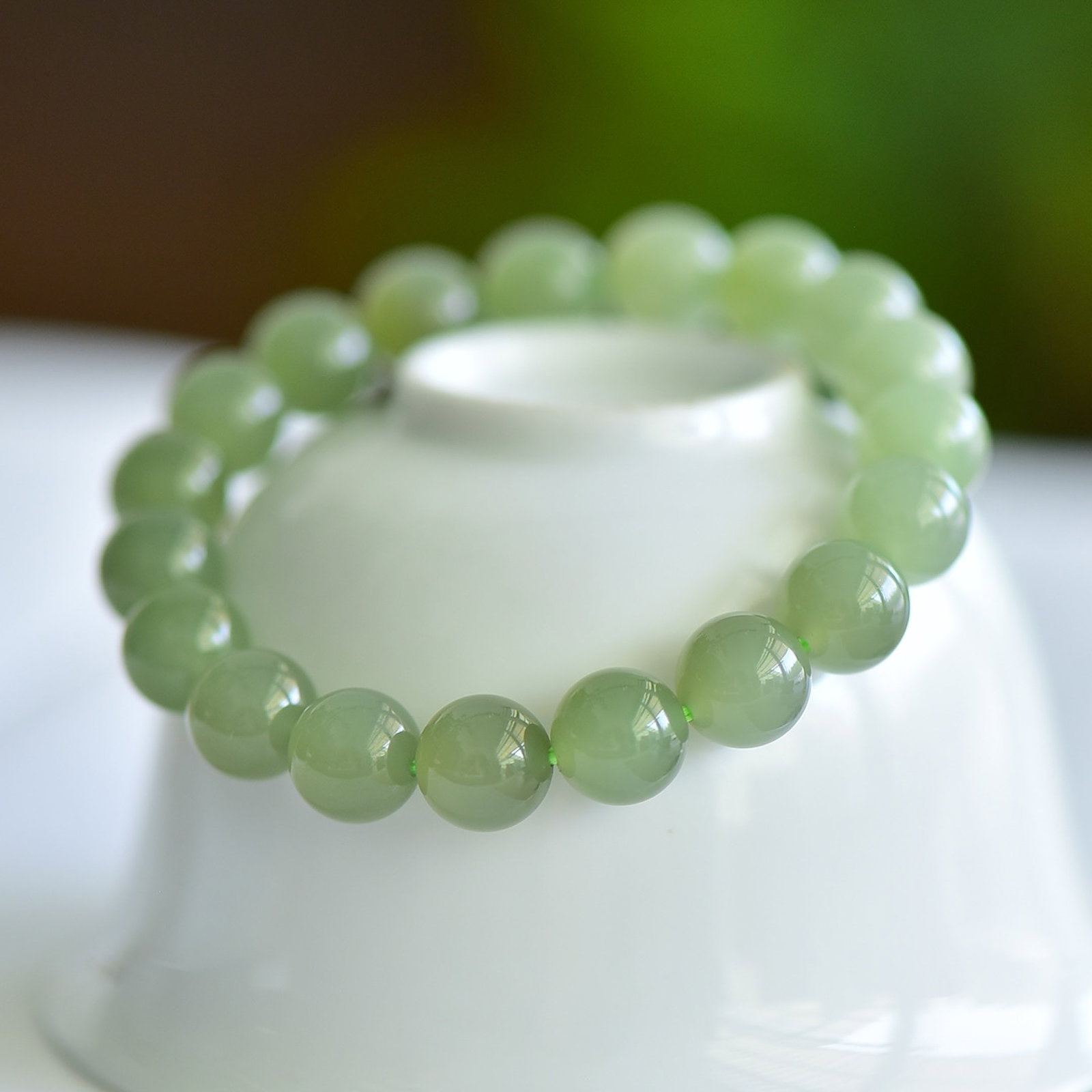 An Exquisite White Jade Eight Treasures Pattern Pendant: An Exquisite Greenish Jade Bracelets,Size:10mm 青白玉手串