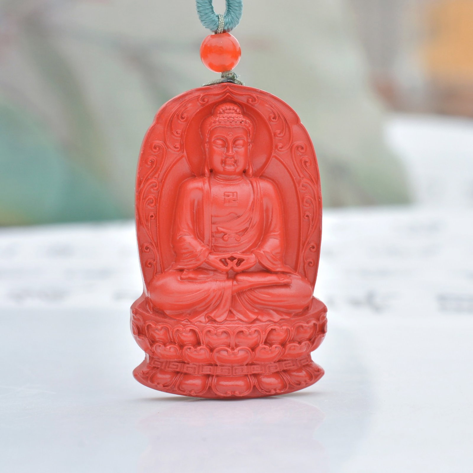 An Exquisite Cinnabar Sakyamuni Pattern Pendant: An Exquisite Cinnabar Sakyamuni Pattern Pendant,Size:25mmx39mm