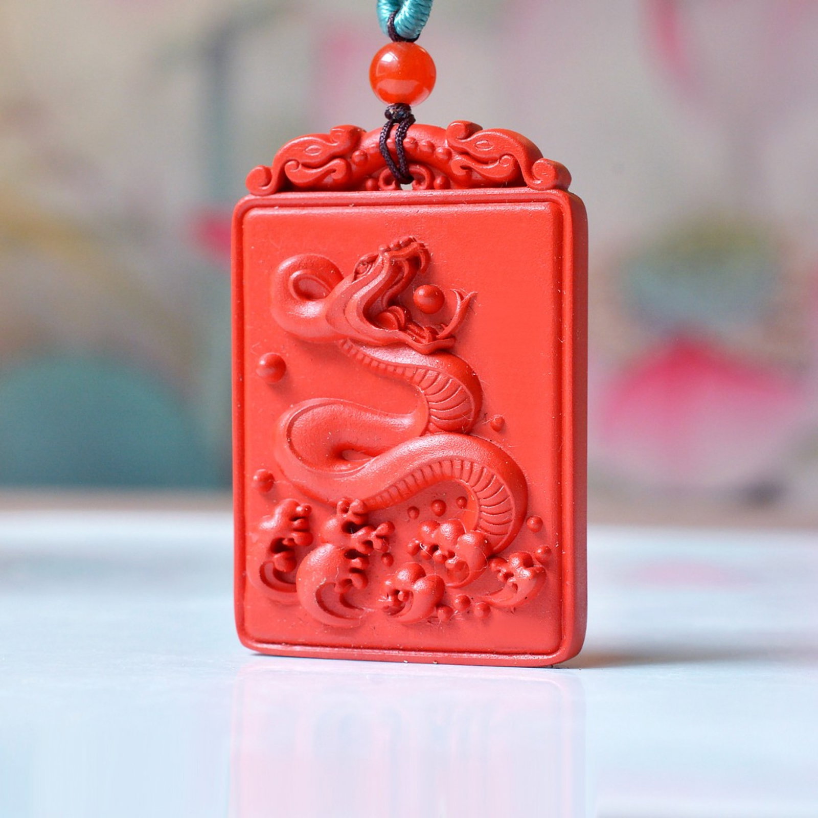 An Exquisite Cinnabar Auspicious Cloud and Snake Pattern Pendant: An Exquisite Cinnabar Auspicious Cloud and Snake Pattern Pendant,Size:27mmx39mm (寓意)吉祥招财喜庆、驱邪避凶