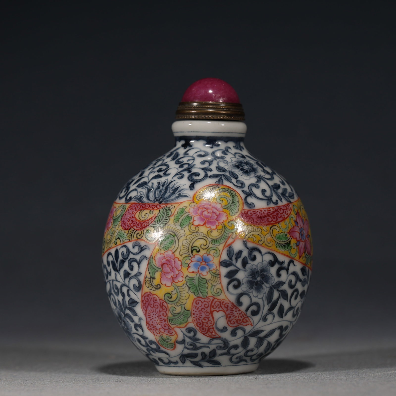 An Exquisite Blue and White with Colored Enamel Interlocking Flower Pattern Snuff Bottle (1 of 5)
