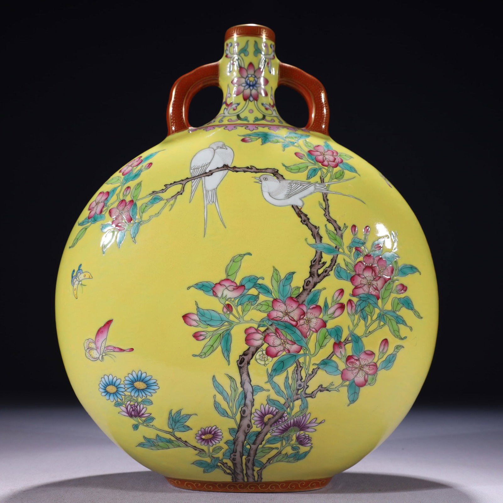 An Exquisite Yellow Ground Famille-Rose Painted Gold Flower and Bird Pattern Double-Ears Vase: An Exquisite Yellow Ground Famille-Rose Painted Gold Flower and Bird Pattern Double-Ears Vase,Qing Dynasty,China,Qianlong Six-character Mark,Size:9.4inx3.9inx12.2in,Weight:3350g 黄地౴