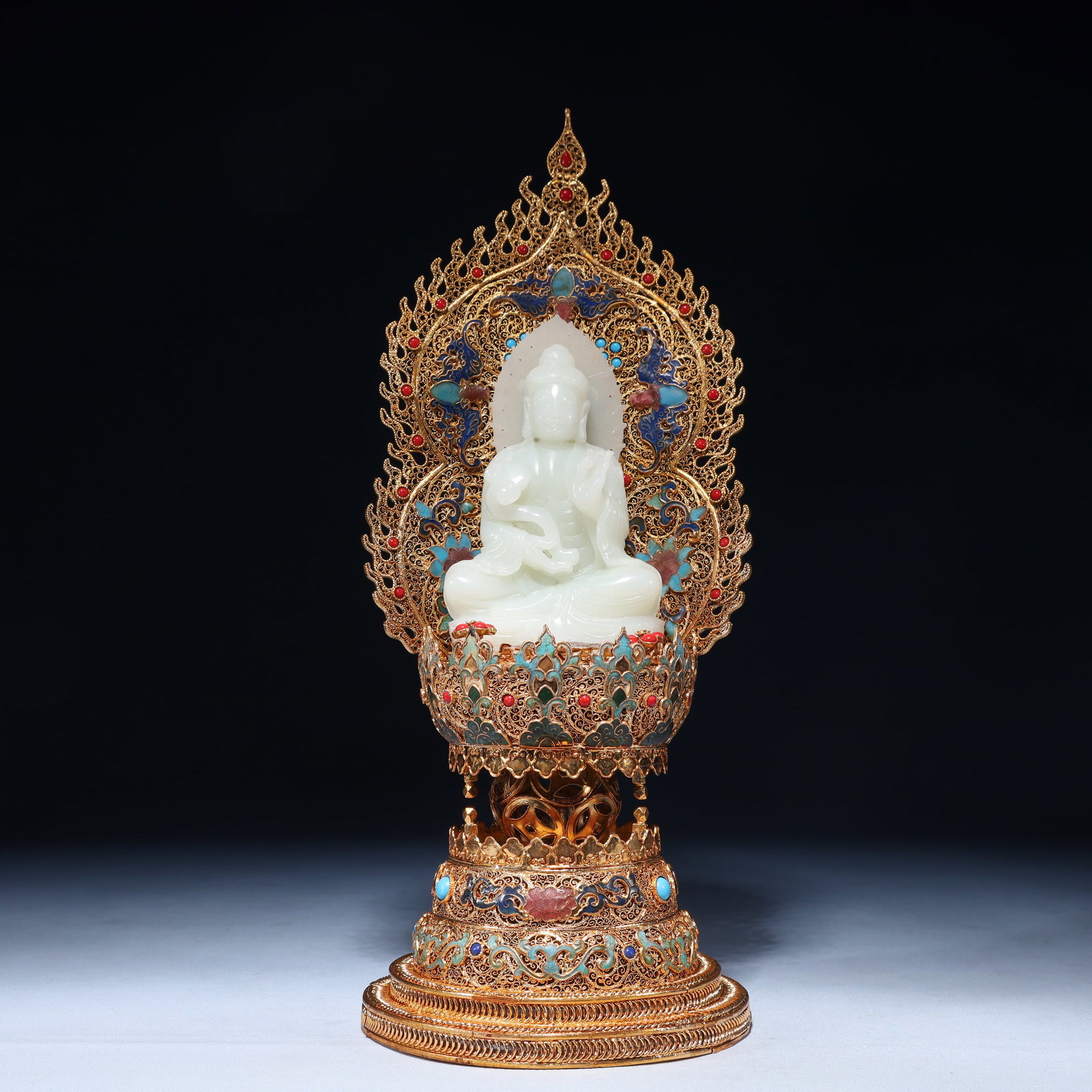 An Exquisite Filigree and Gilding Inlaid White Jade Buddha Statue, Inlaid Gems: An Exquisite Filigree and Gilding Inlaid White Jade Buddha Statue, Inlaid Gems, Qing Dynasty,China, Qianlong Four-character Mark, Size:5.1inx13.8in,Weight:1300g 花丝鎏金嵌