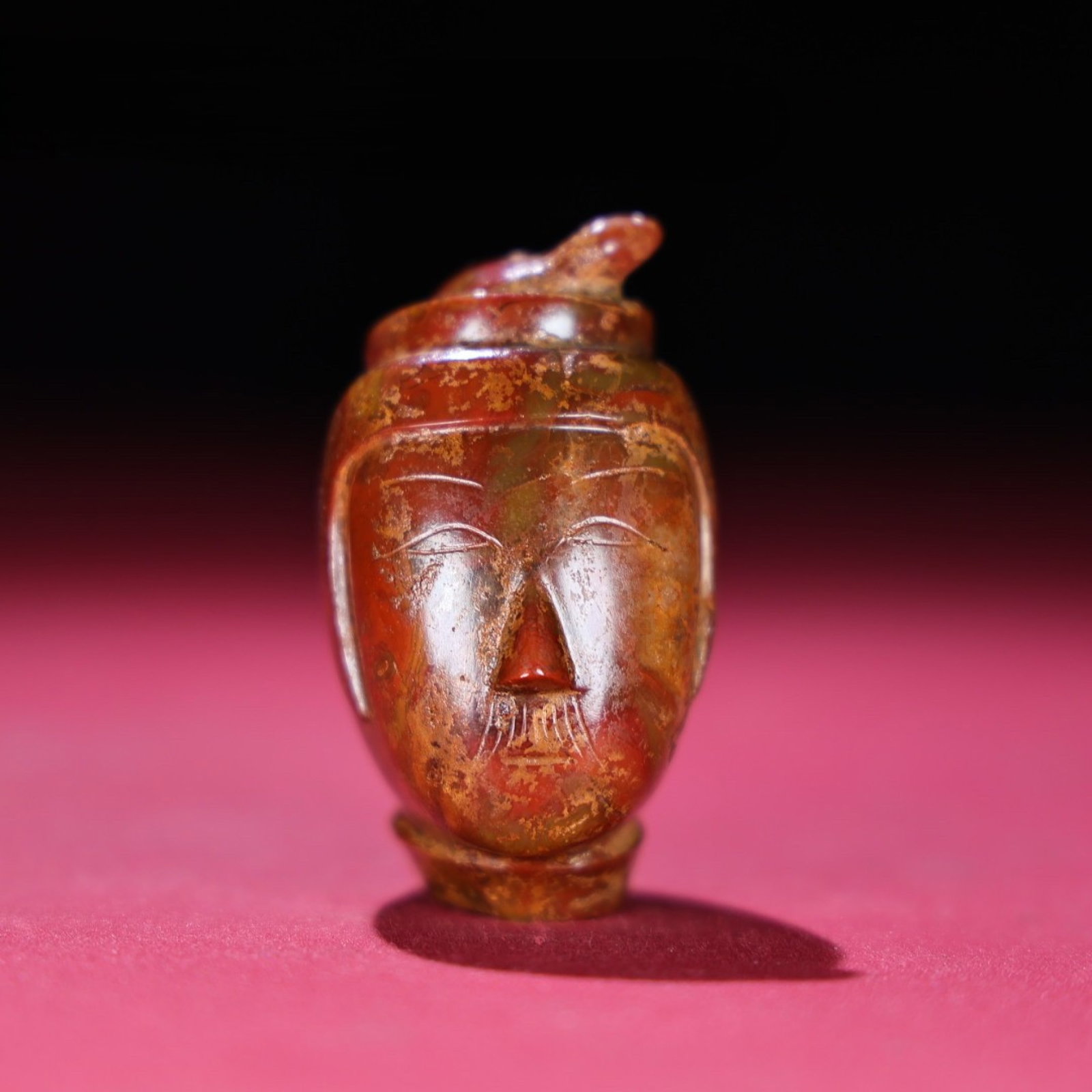 An Exquisite Agate Statue of Figure Head: An Exquisite Agate Statue of Figure Head,the Warring States period in China,Size:59mmx35mmx45mm,Weight:113g 玛瑙人物头像,中国战国时