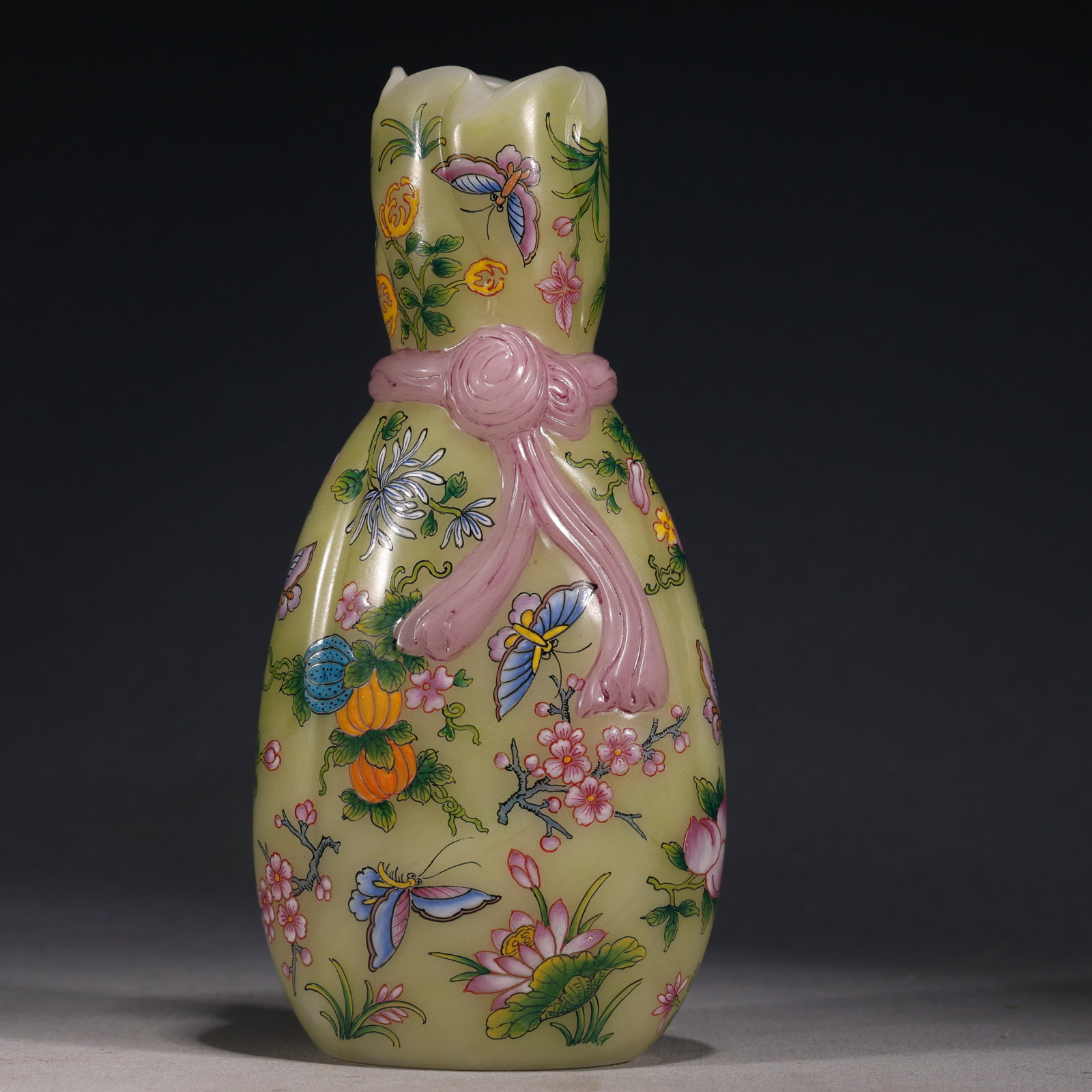 An Exquisite Glass Body Painted Enamel Cloth Bundle Vase With Flower And Butterfly Pattern: An Exquisite Glass Body Painted Enamel Cloth Bundle Vase With Flower And Butterfly Pattern，China, Qing Dynasty, Four-Character Qianlong Mark, Dimensions: 6.3inx2.4inx7.9in, Weight: