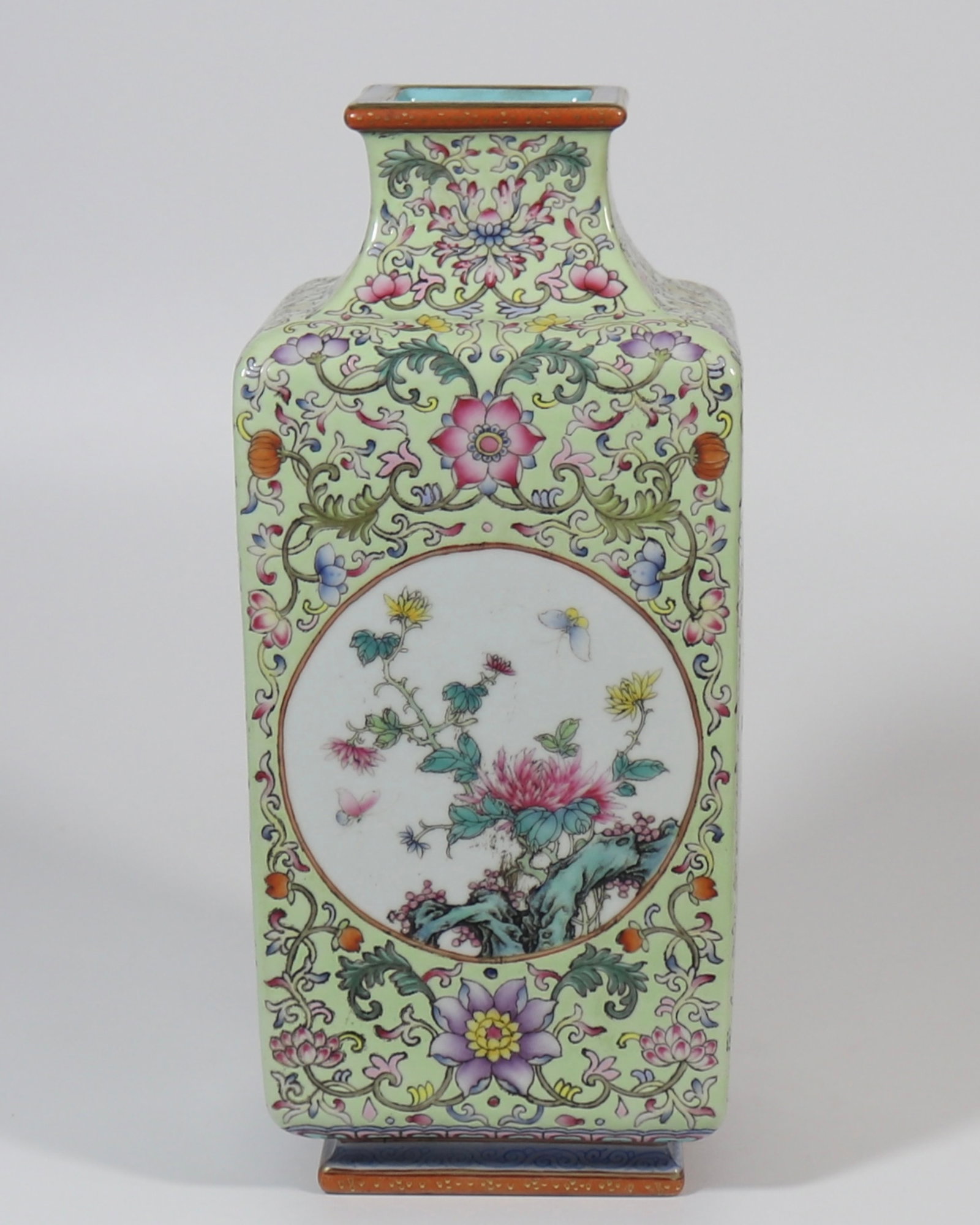 A fine apple-green ground square vase with four reserved seasonal flower panels: A fine apple-green ground square vase with four reserved seasonal flower panels, Qing Dynasty, China, with six-character Qianlong reign mark, Size:12.6inx5.5in 苹果绿釉地