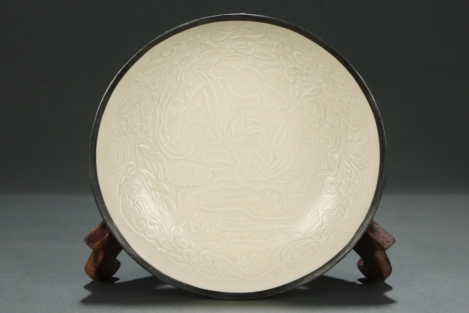 An Exquisite Ding yao White Glazed Cover with Bronze Flower and Mandarin Duck Pattern Plate: An Exquisite Ding yao White Glazed Cover with Bronze Flower and Mandarin Duck Pattern Plate,Song Dynasty,China,Size:1.8inx8.1in 定窑白釉包铜花卉鸳