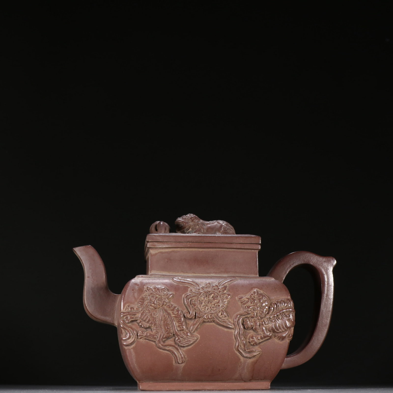 A Rare Purple Sands Lion Pattern Teapot: A Rare Purple Sands Lion Pattern Teapot,Qing Dynasty,China,Chen Guangming Mark,Size:5.5inx8.7in 紫砂狮子纹茶壶,中国清代,陈ࠠ