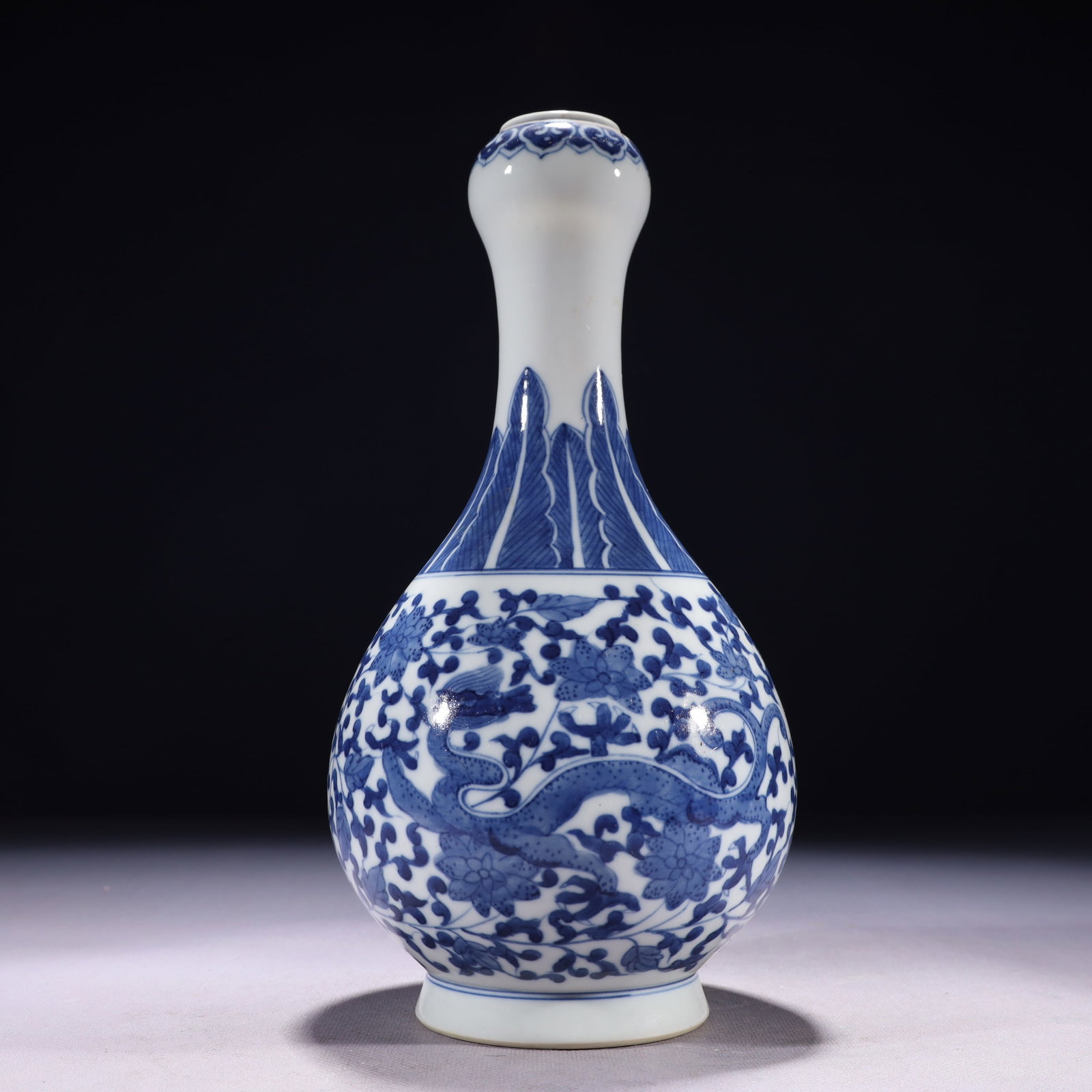 An Exquisite Blue and White Lotus and Dragon Pattern Vase: An Exquisite Blue and White Lotus and Dragon Pattern Vase,Qing Dynasty,China,Qianlong Six-character Mark,Size:5.1inx10.6in,Weight:800g 青花缠枝莲龙纹瓶,