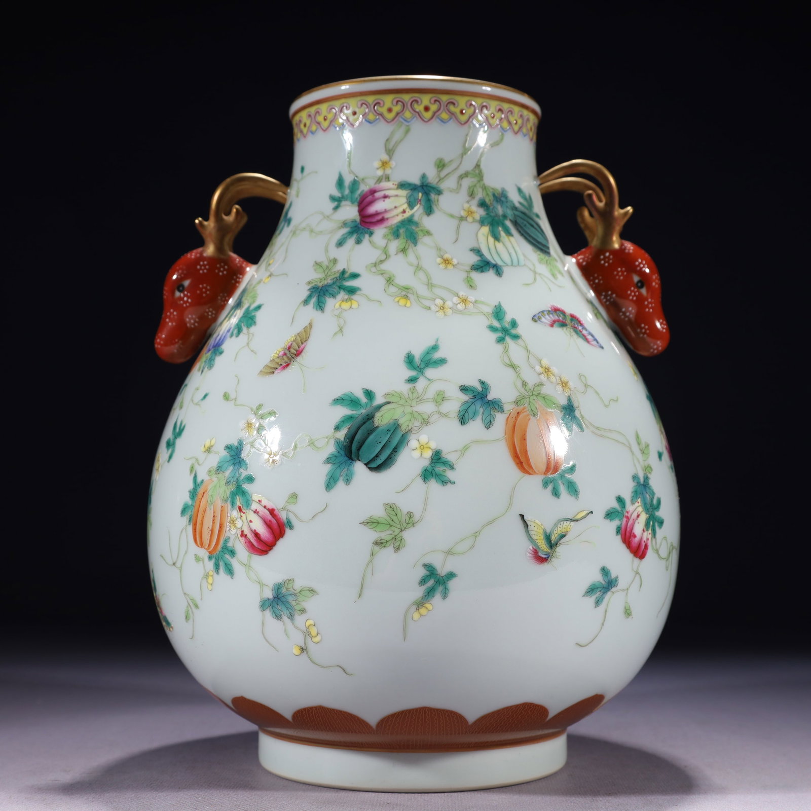 An Exquisite Famille-Rose Painted Gold Melon and Butterfly Pattern Deer-Ears Vase: An Exquisite Famille-Rose Painted Gold Melon and Butterfly Pattern Deer-Ears Vase,Qing Dynasty,China,Qianlong Six-character Mark,Size:7.5inx10.2in,Weight:2100g