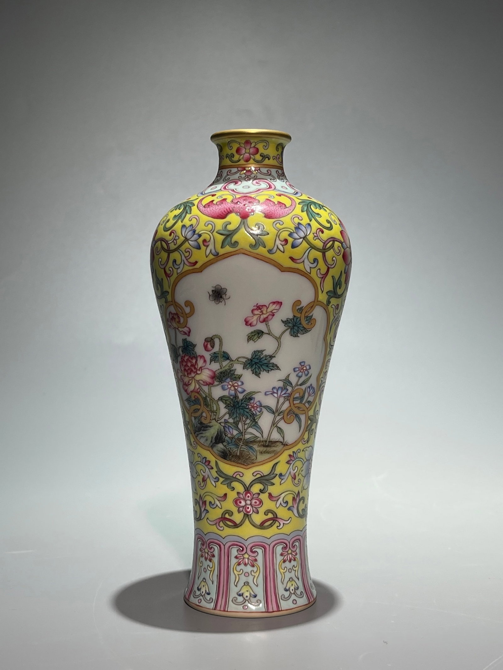 An Exquisite Yellow Ground Famille-Rose Painted Gold Flower and Butterfly Pattern Vase: An Exquisite Yellow Ground Famille-Rose Painted Gold Flower and Butterfly Pattern Vase,Qing Dynasty,China,Yongzheng Six-character Mark,Size:7.2inx3.1in 黄地粉彩描金