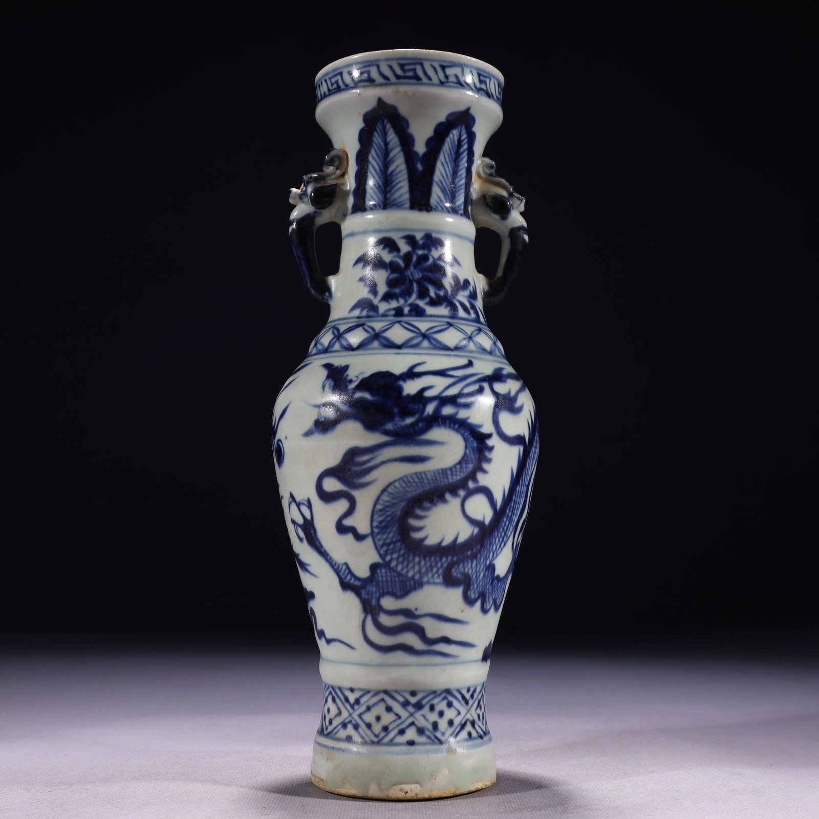 An Exquisite Blue and White Auspicious Cloud and Dragon Pattern Double-Ears Vase: An Exquisite Blue and White Auspicious Cloud and Dragon Pattern Double-Ears Vase,Qing Dynasty,China,Size:3.5inx10.6in,Weight:800g