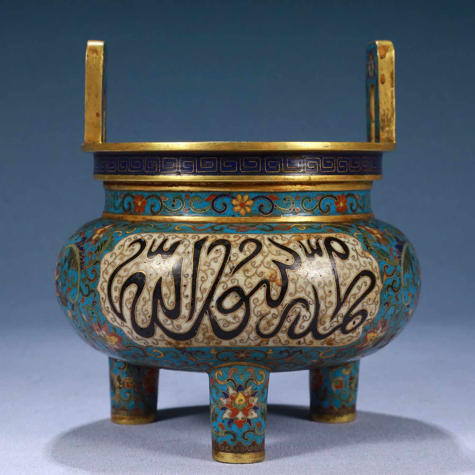 An Exquisite Cloisonne Lotus Pattern Double-Ears and Tripod Censer,With Sanskrit: An Exquisite Cloisonne Lotus Pattern Double-Ears and Tripod Censer,With Sanskrit,Qing Dynasty, China,Qianlong Four-character Mark,Size:5.1inx6.8in,Weight:1150g