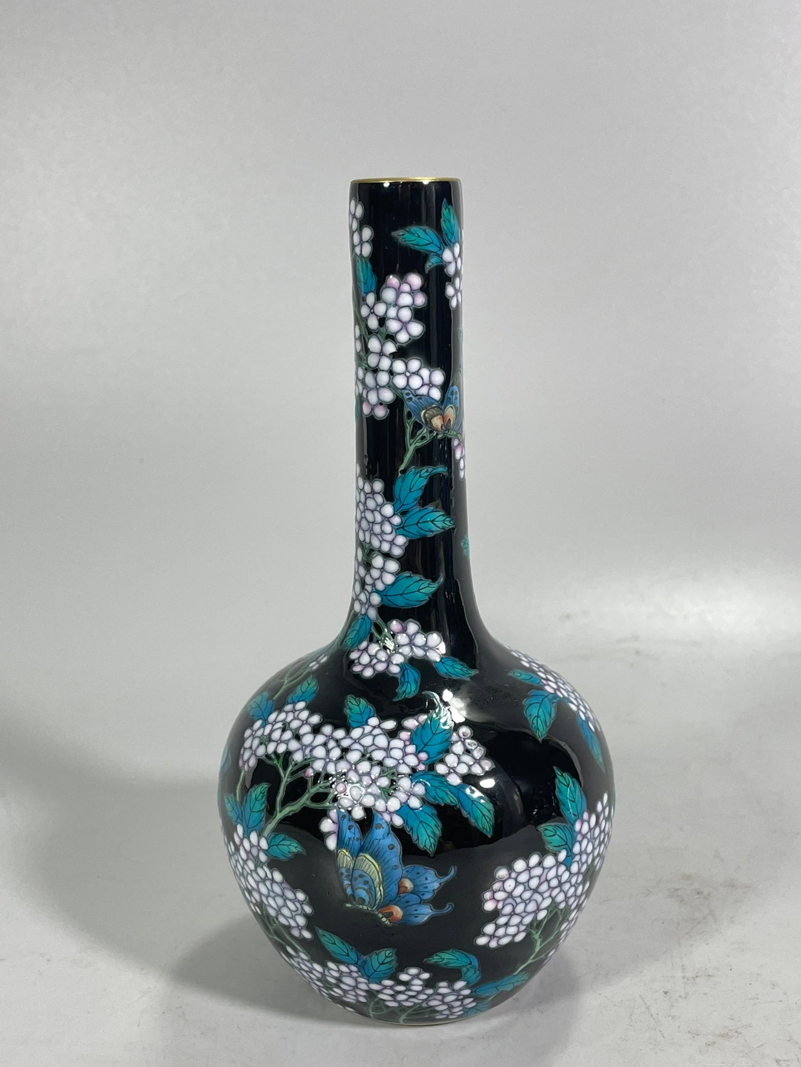 An Exquisite Ugyen Glazed Enamel Flower and Butterfly Pattern Vase: An Exquisite Ugyen Glazed Enamel Flower and Butterfly Pattern Vase,Qing Dynasty,China,Yongzheng Six-character Mark,Size:6.1inx3.1in 乌金釉珐琅彩花卉"