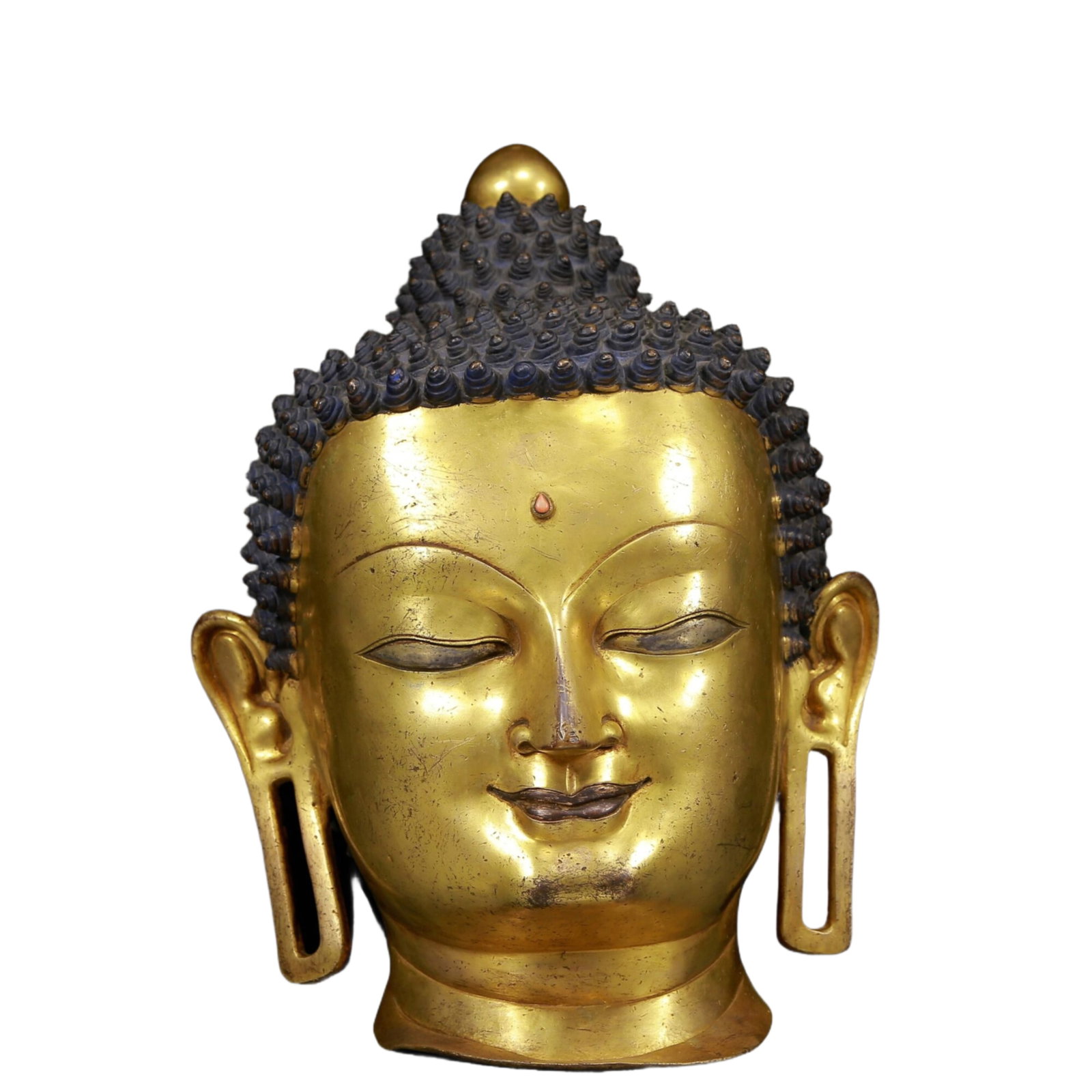 A Brilliant Gilt-Bronze Head Of Buddha Shakyamuni: A Brilliant Gilt-Bronze Head Of Buddha Shakyamuni. Superbly and sensitively sculpted in the form of the head of Buddha Shakyamuni, with well-defined arched eyebrows juxtaposed with the prominent nose 