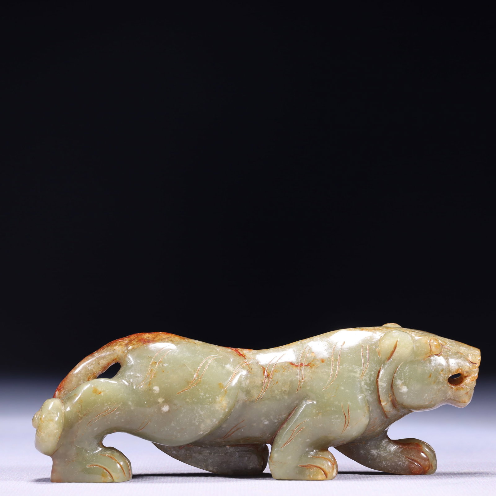 An Exquisite Green Jade Tiger Ornament: An Exquisite Green Jade Tiger Ornament,Qing Dynasty,China,Size:5.5inx1.2inx1.8in,Weight:238g 青玉老虎摆件,中国清代