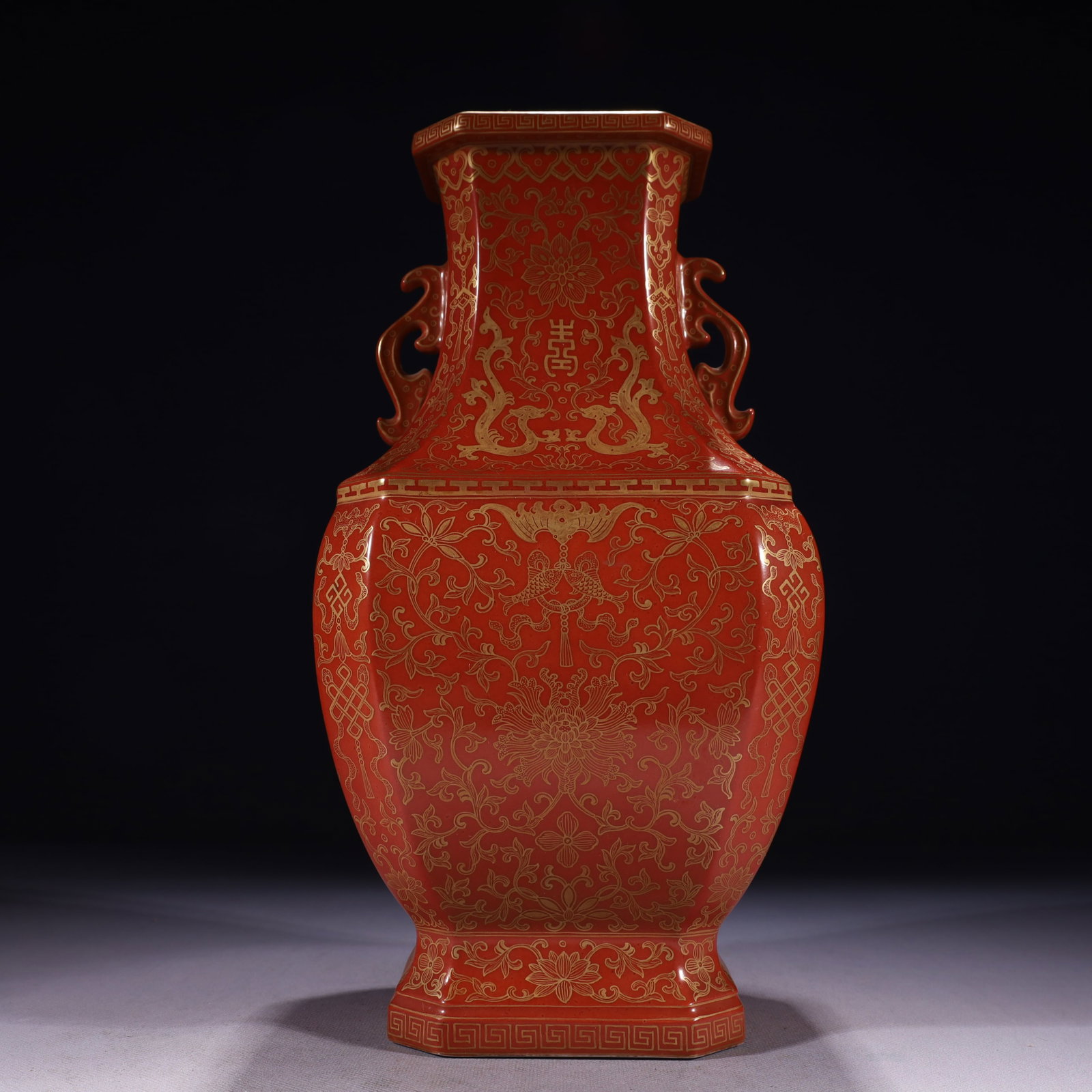 An Exquisite Red Glazed Painted Gold Lotus Pattern Double-Ears Vase: An Exquisite Red Glazed Painted Gold Lotus Pattern Double-Ears Vase,Qing Dynasty,China,Qianlong Six-character Mark,Size:6.3inx5.5inx12.2in,Weight:2450g
