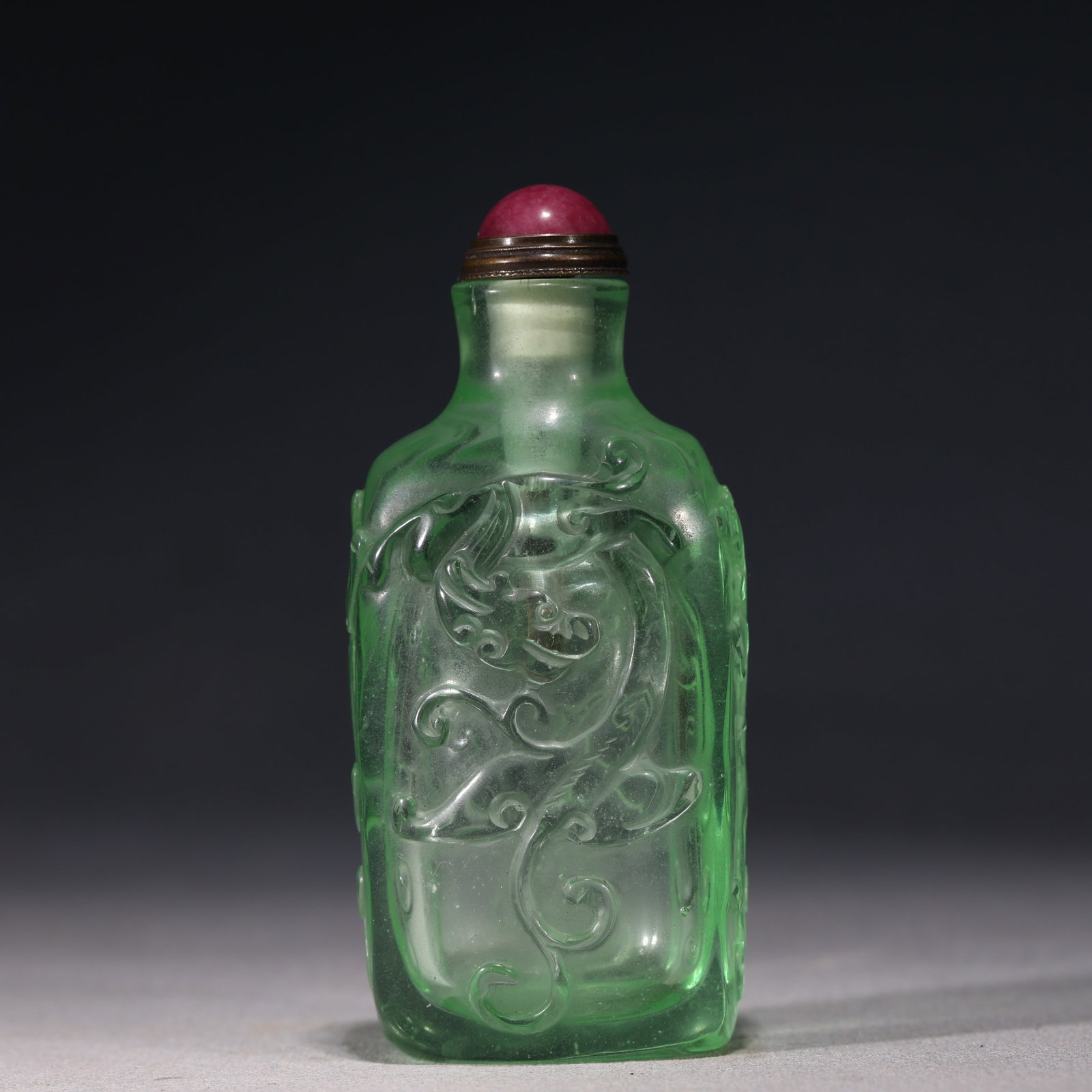 An Exquisite Emerald Green Glass Relief Chilong Dragon Pattern Snuff Bottle: An Exquisite Emerald Green Glass Relief Chilong Dragon Pattern Snuff Bottle,Qing Dynasty, China,Yongzheng Four-character Mark,Size:1.6in×1.1in×3.5in