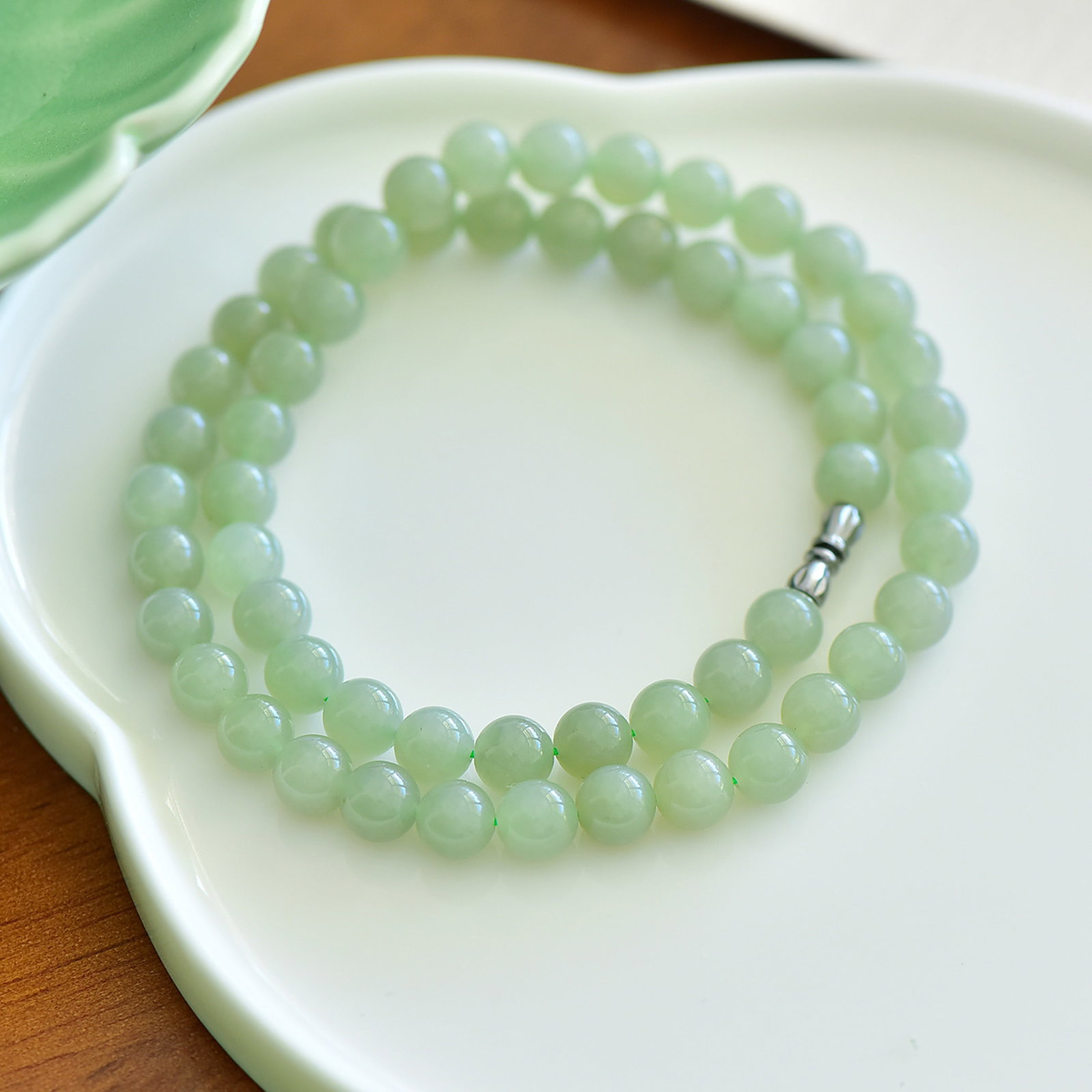 An Exquisite Greenish Jade Necklace: An Exquisite Greenish Jade Necklace,Size:8mm 寓意:『平安幸福·财源滚滚』 青白玉项链