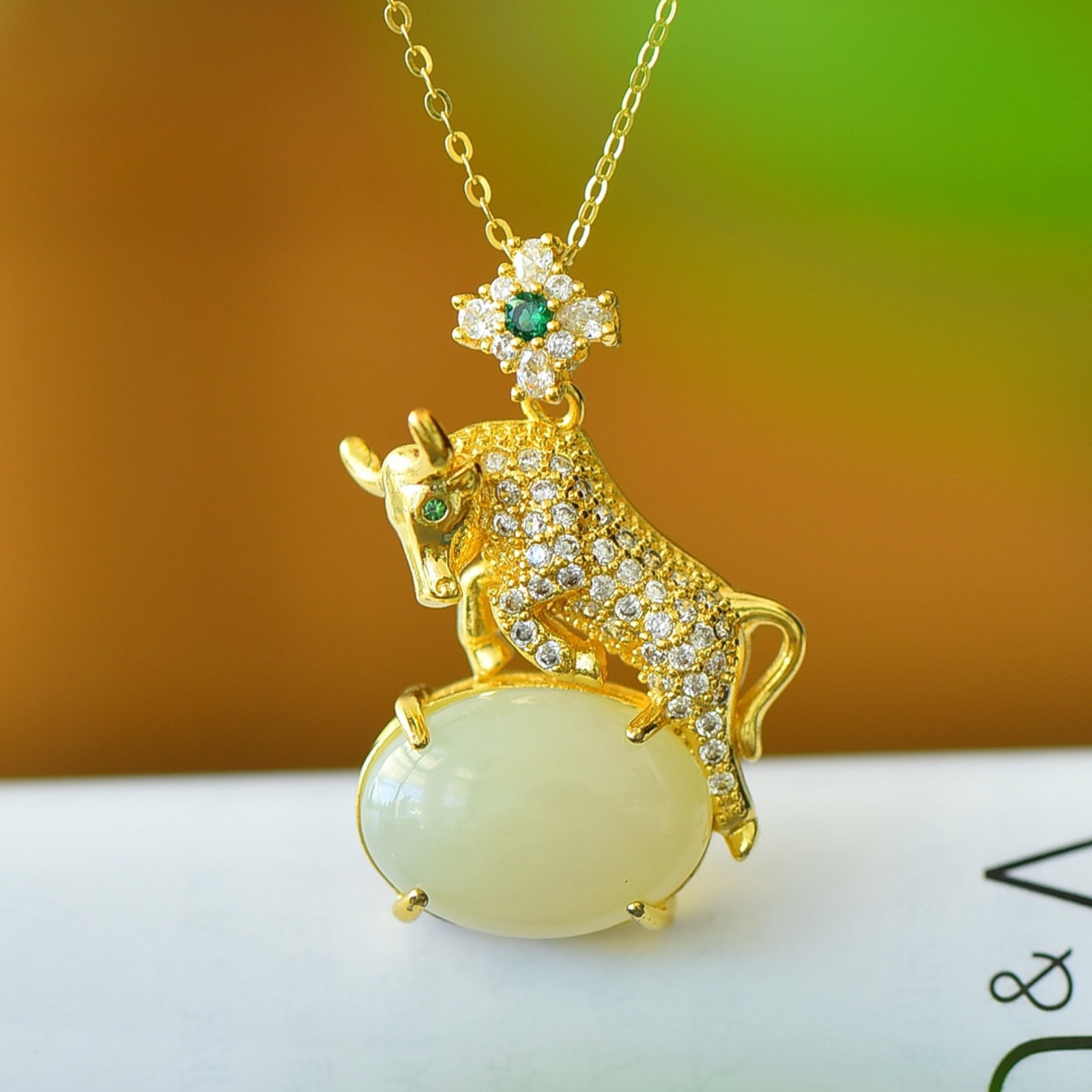 An Exquisite Bronze-Gold Plated Inlaid White Jade Buffalo Necklace: An Exquisite Bronze-Gold Plated Inlaid White Jade Buffalo Necklace,Size:5.1inx7.1in 铜镀金镶白玉牛项链
