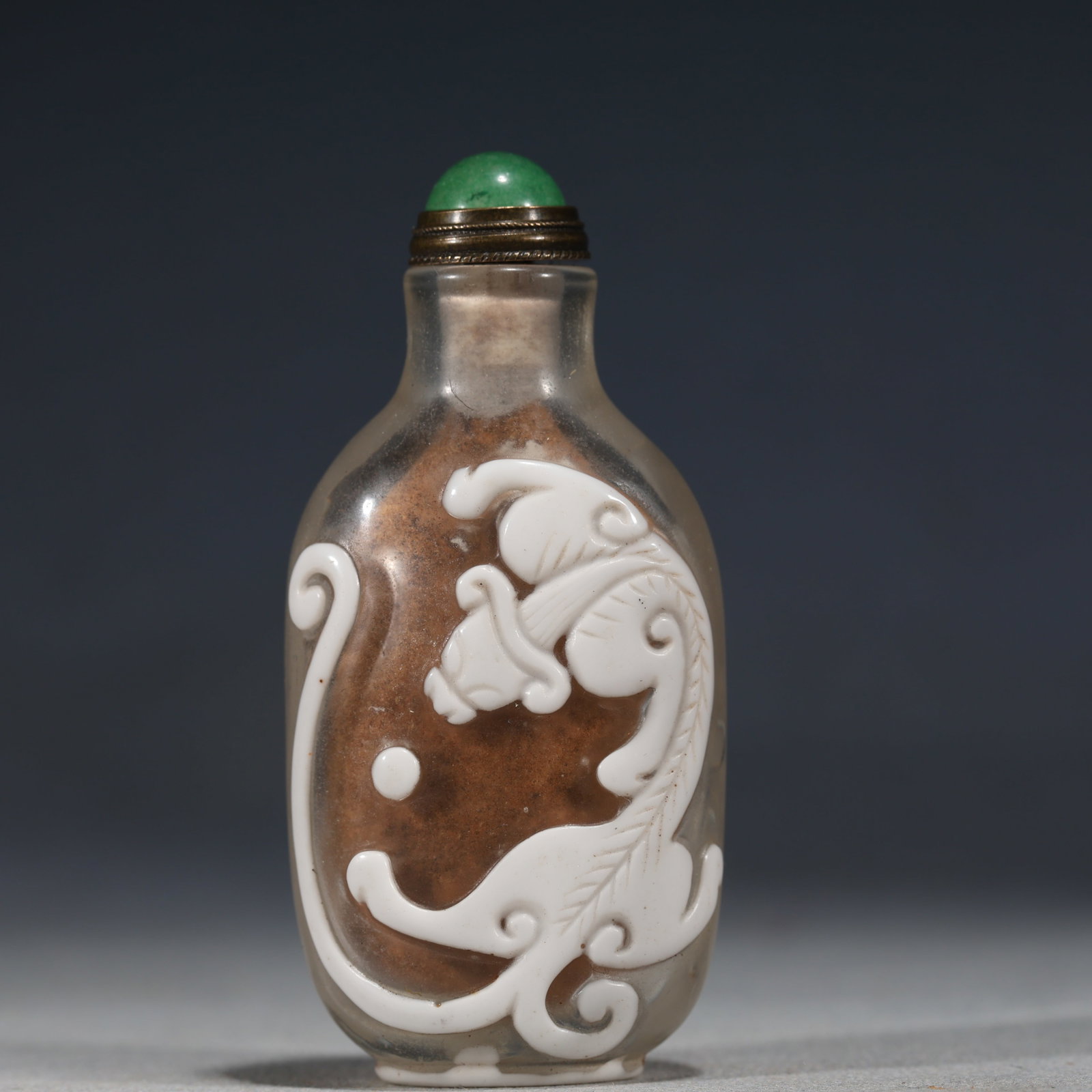 An Exquisite Overlaid White Glass Snuff Bottle With Chi Dragon Pattern (1 of 5)