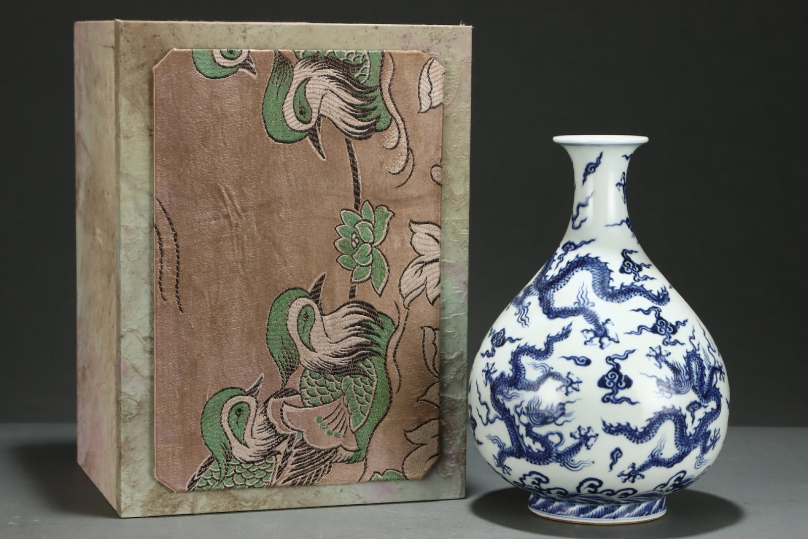 An Exquisite Blue and White Auspicious Cloud and Dragon Pattern Vase: An Exquisite Blue and White Auspicious Cloud and Dragon Pattern Vase,Ming Dynasty,China,Xuande Six-character Mark,Size:10.4inx7.2in