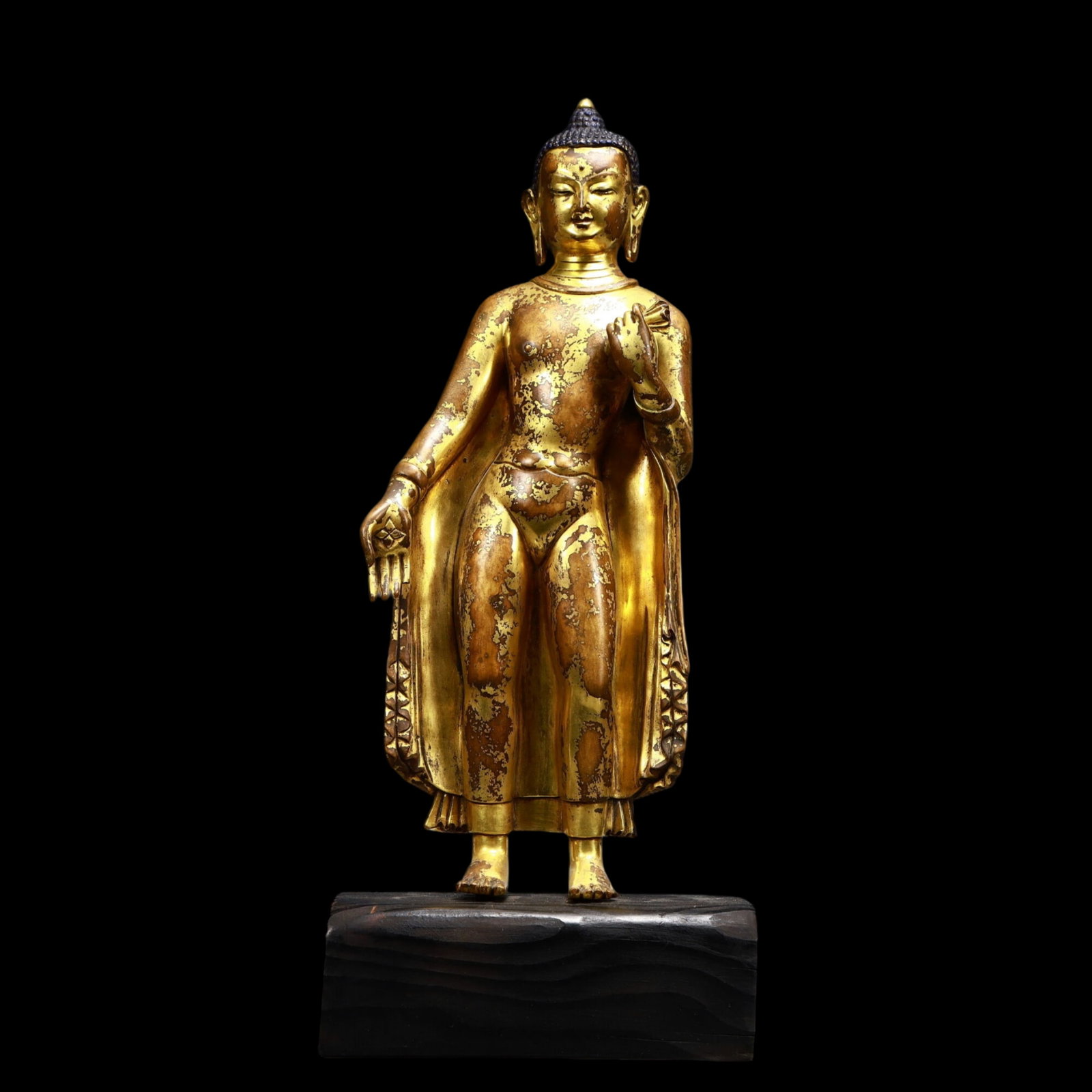 A Solemn Gilt Bronze Statue of Sakyamuni: A Solemn Gilt Bronze Statue of Sakyamuni,Ming Dynasty, China,Size:7.1inx3.5inx16.9in,Weight:3700g 铜鎏金释迦摩尼像,中国明代