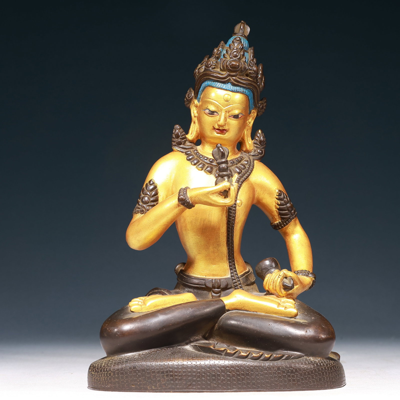 A Solemn Gilt Bronze Buddha Statue: A Solemn Gilt Bronze Buddha Statue,Qing Dynasty,China,Size:7.1inx4.5inx11in,Weight:3150g 铜鎏金佛像,中国清代