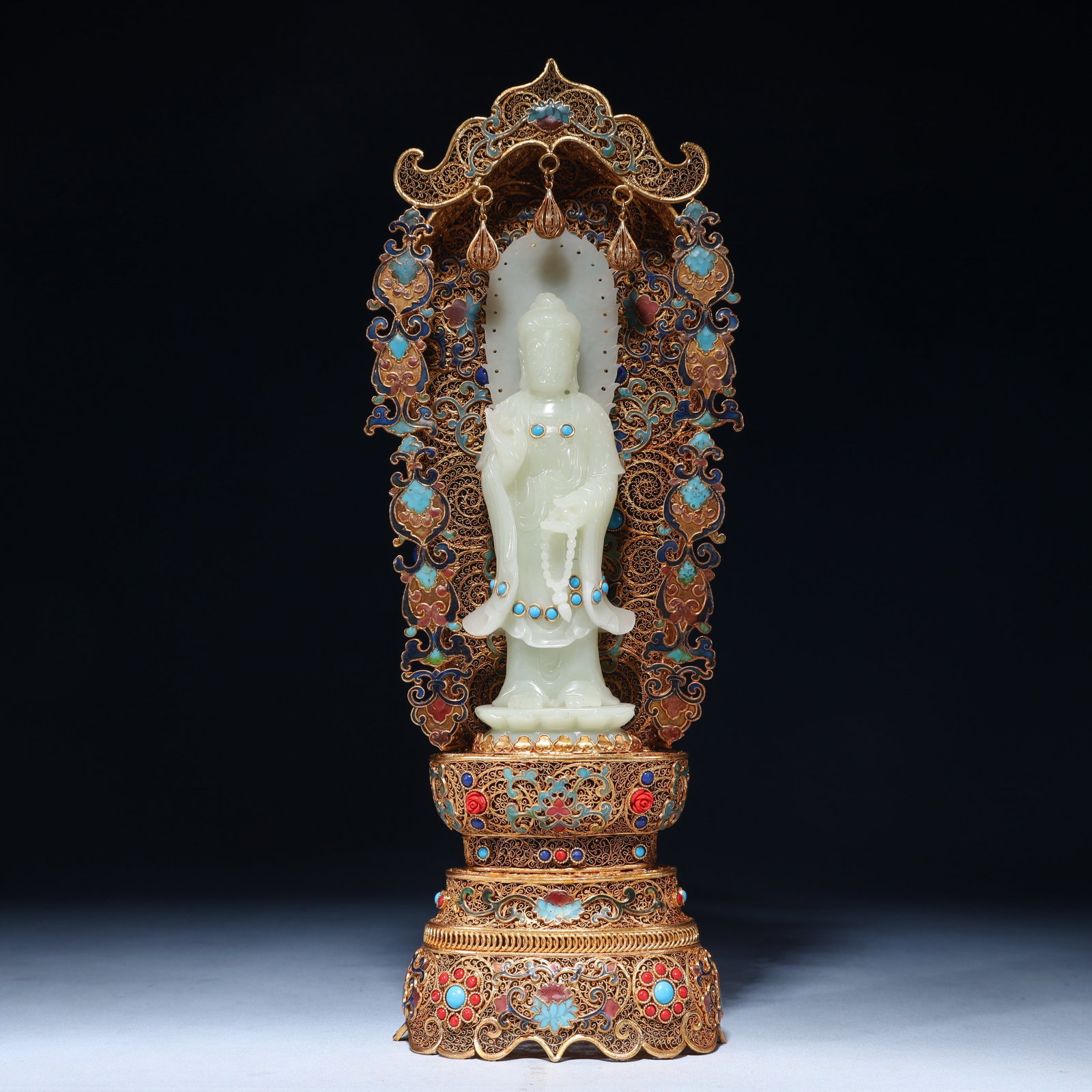 An Exquisite Filigree and Gilding Inlaid White Jade Buddha Statue, Inlaid Gems: An Exquisite Filigree and Gilding Inlaid White Jade Buddha Statue, Inlaid Gems, Qing Dynasty,China, Qianlong Four-character Mark, Size:4.7inx3.5inx14.6in,Weight:1200g 花丝鎏金&