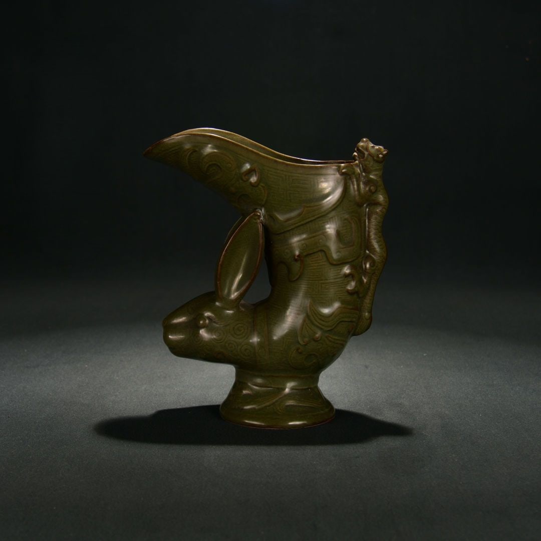 An Exquisite Yue yao Celadon Glazed Rabbit-shaped Cup: An Exquisite Yue yao Celadon Glazed Rabbit-shaped Cup,Song Dynasty, China,Size:8.3inx7.1in 越窑青釉兔形杯,中国宋代