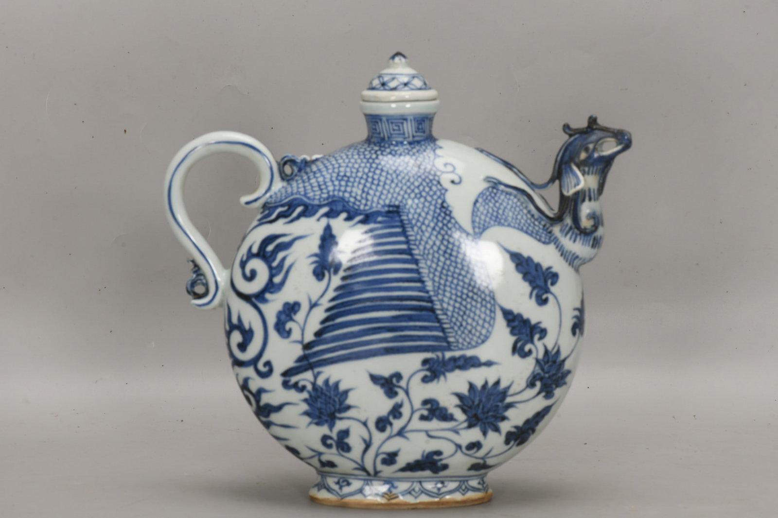 An Exquisite Blue and White Phoenix-head Ewer: An Exquisite Blue and White Phoenix-head Ewer,Yuan Dynasty, China,Size:9.7inx10.2in 青花凤头壶,中国元代