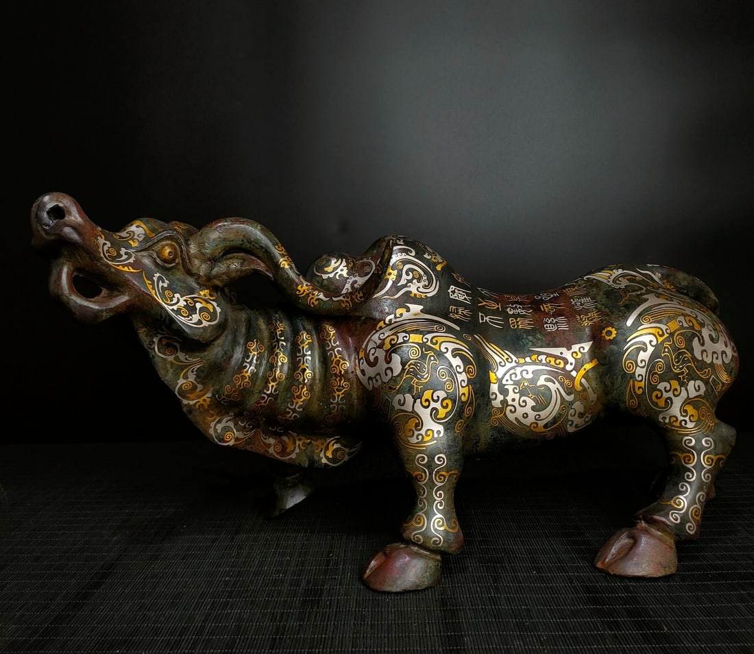 An Exquisite Bronze Inlaid Gold And Silver Buffalo Vase: An Exquisite Bronze Inlaid Gold And Silver Buffalo Vase,Han Dynasty,China,Size:10.2inx21.7in,Weight:4900g 青铜错金银牛瓶,中国汉代